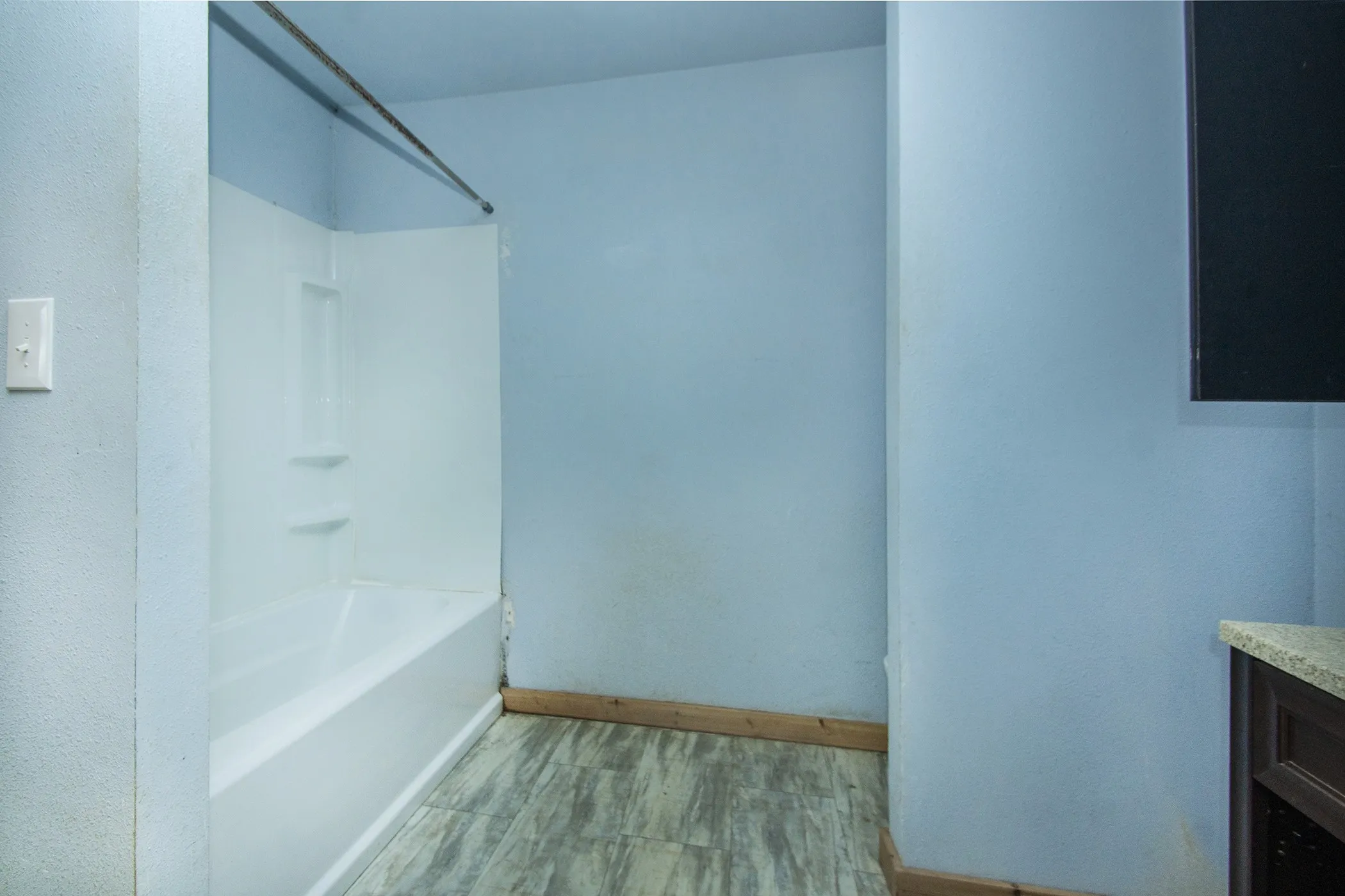 Fiberglass tub and shower combination with integrated shelving