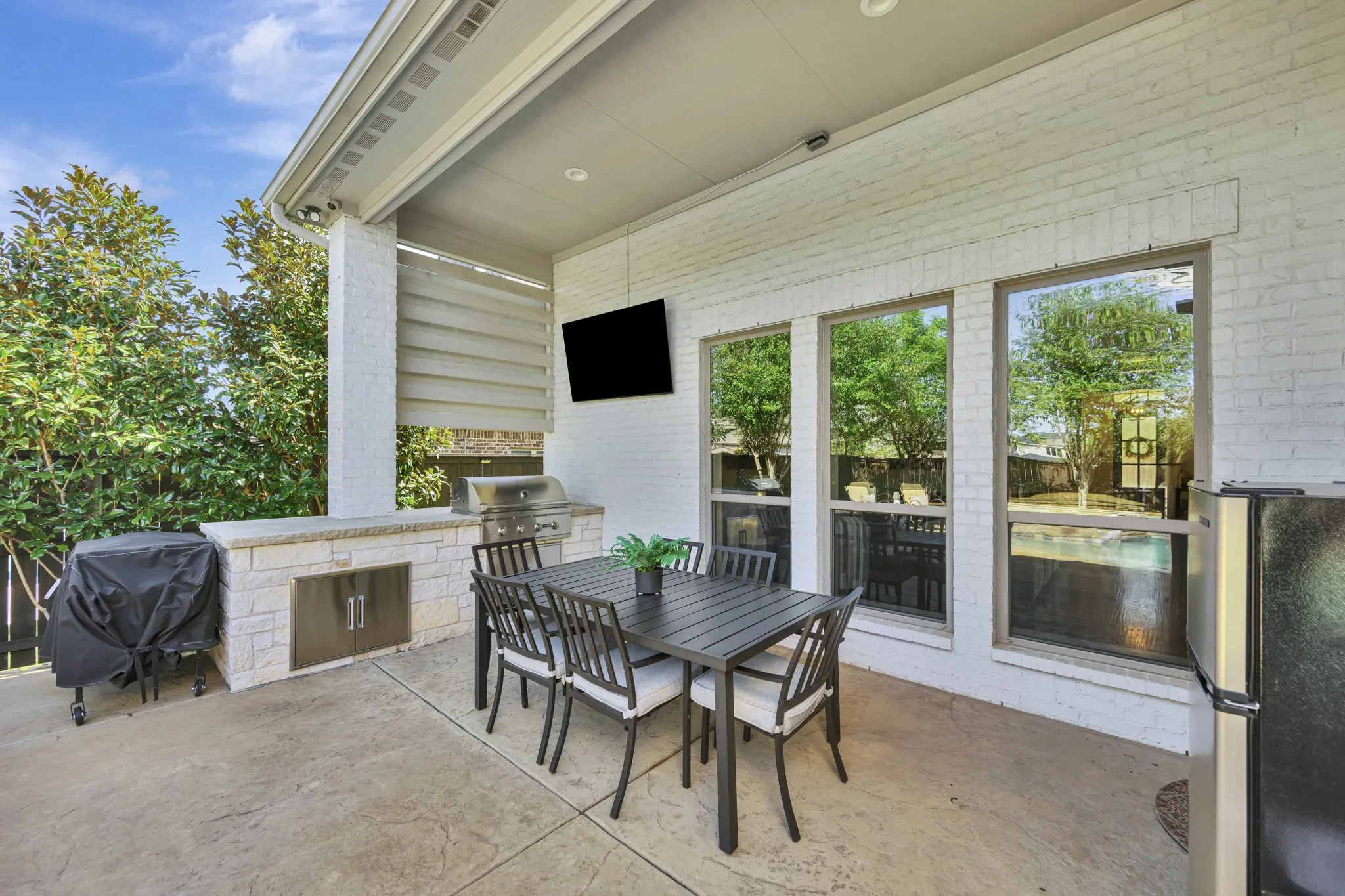 Covered patio and grill area