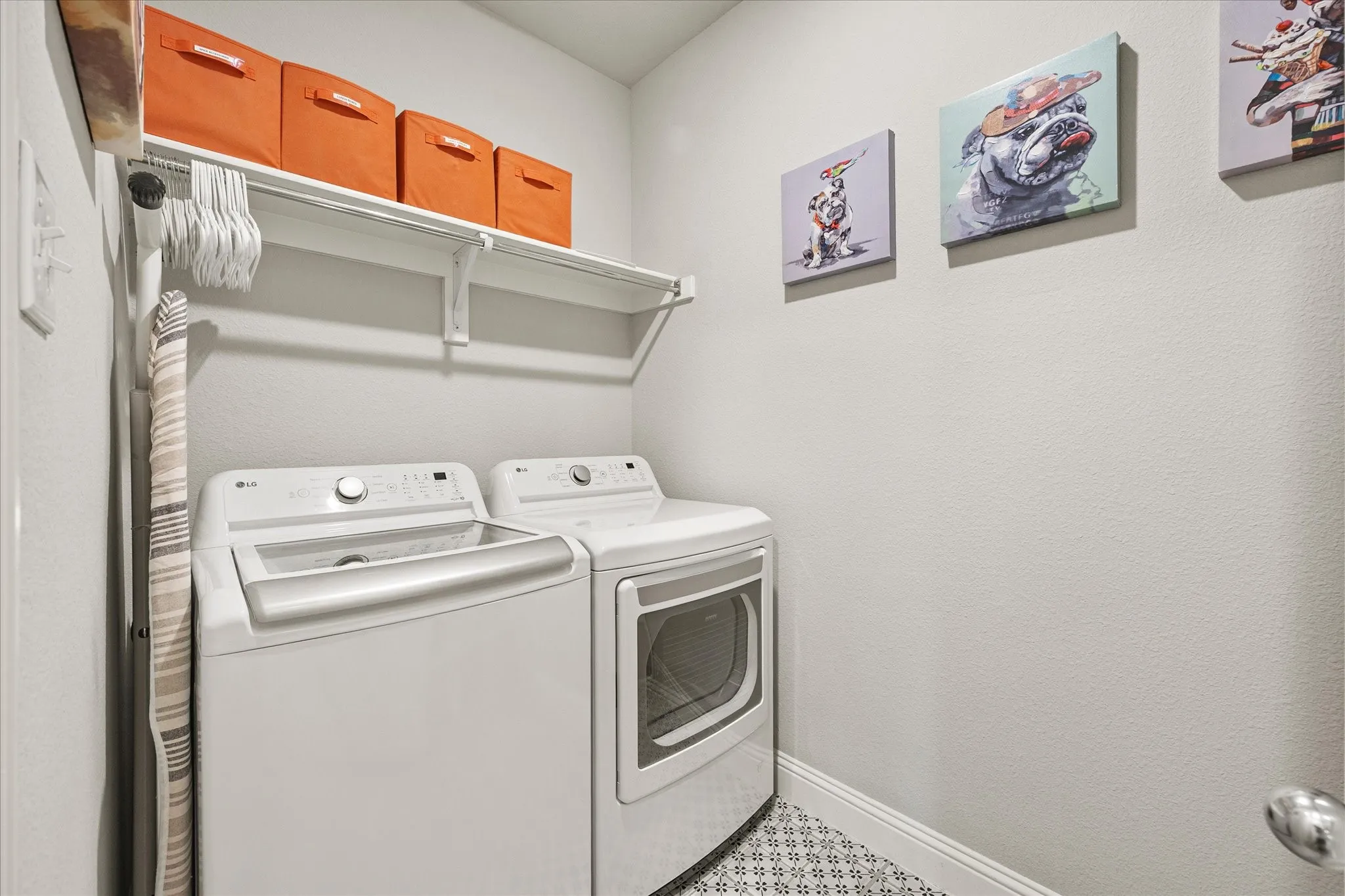 Laundry area featuring a utility shelf and hanging rod