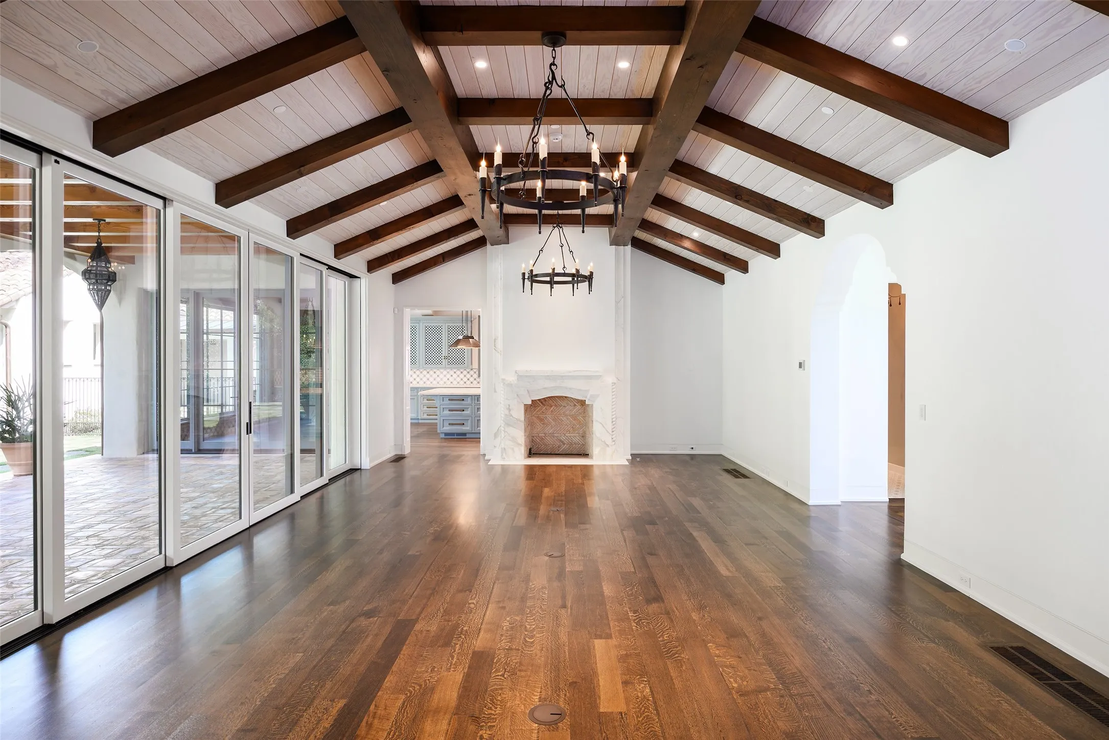 family room open to back covered patio and kitchen