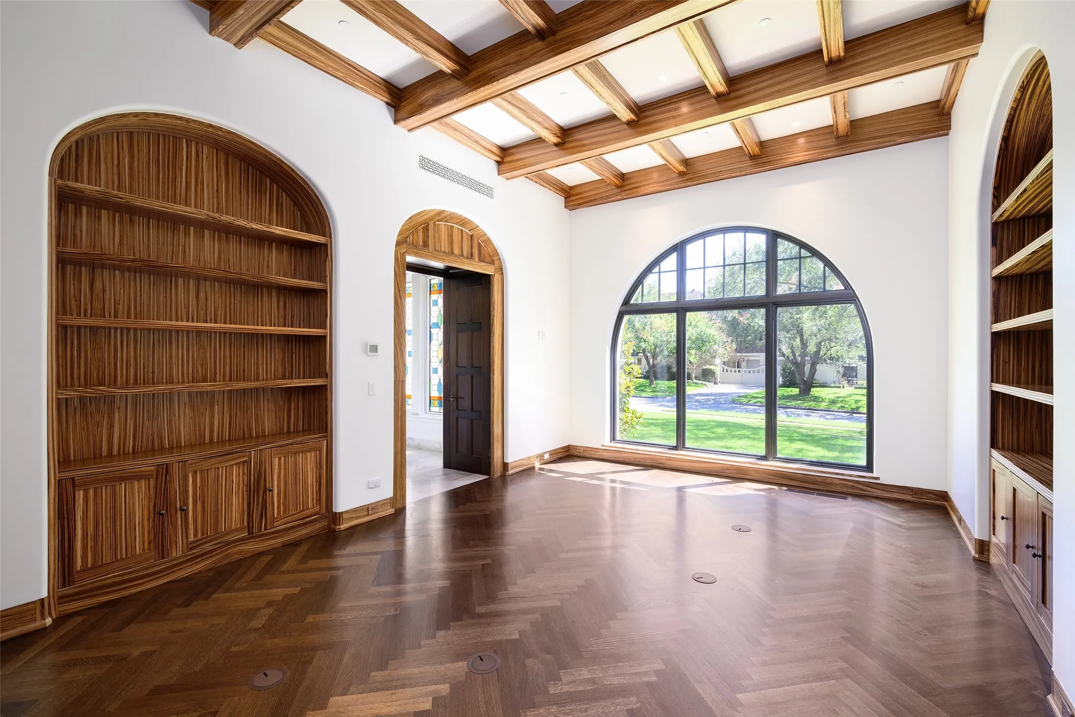 Study with handsome zebra wood and fireplace