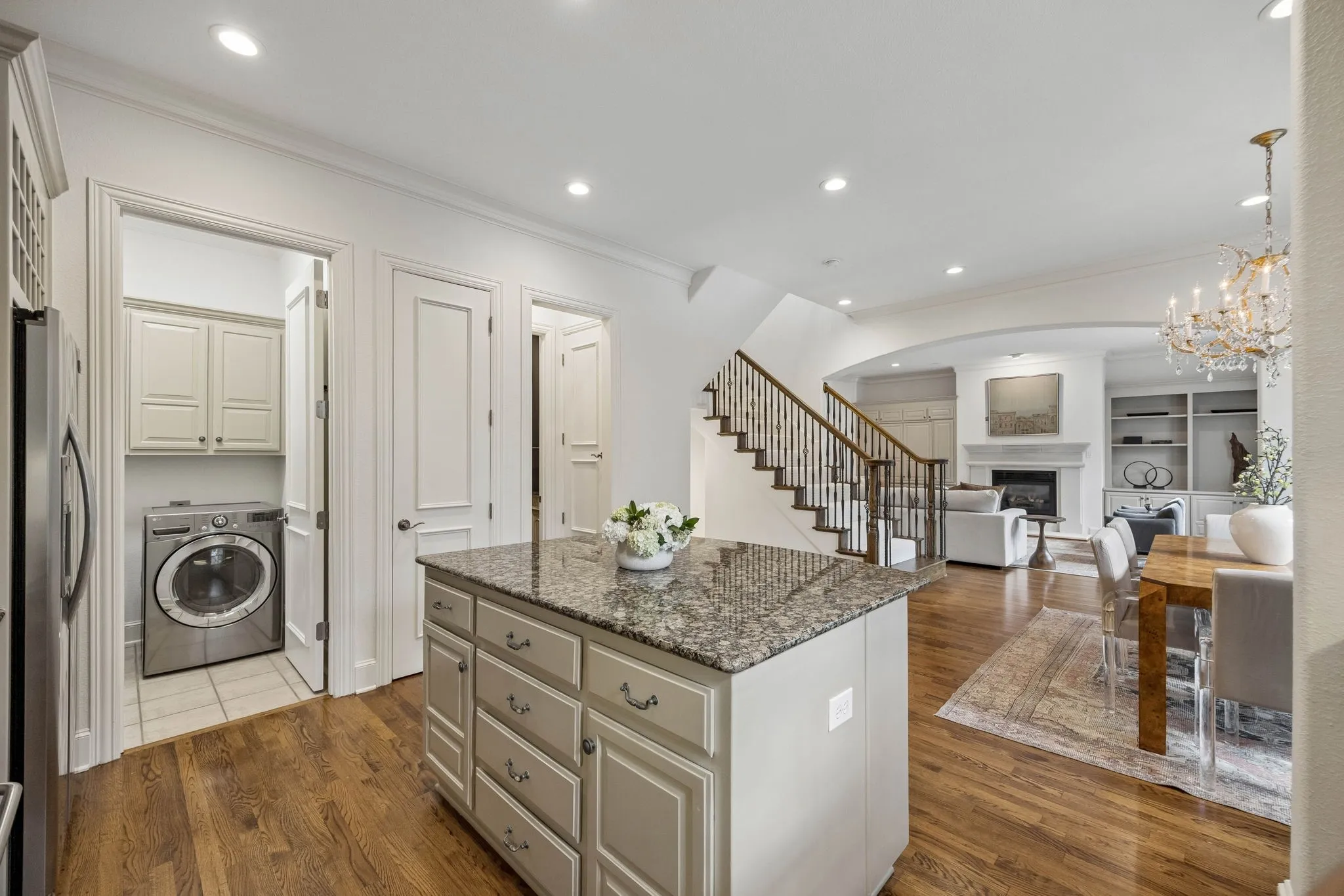 Separate full-size utility room, pantry and powder bathroom off the kitchen.