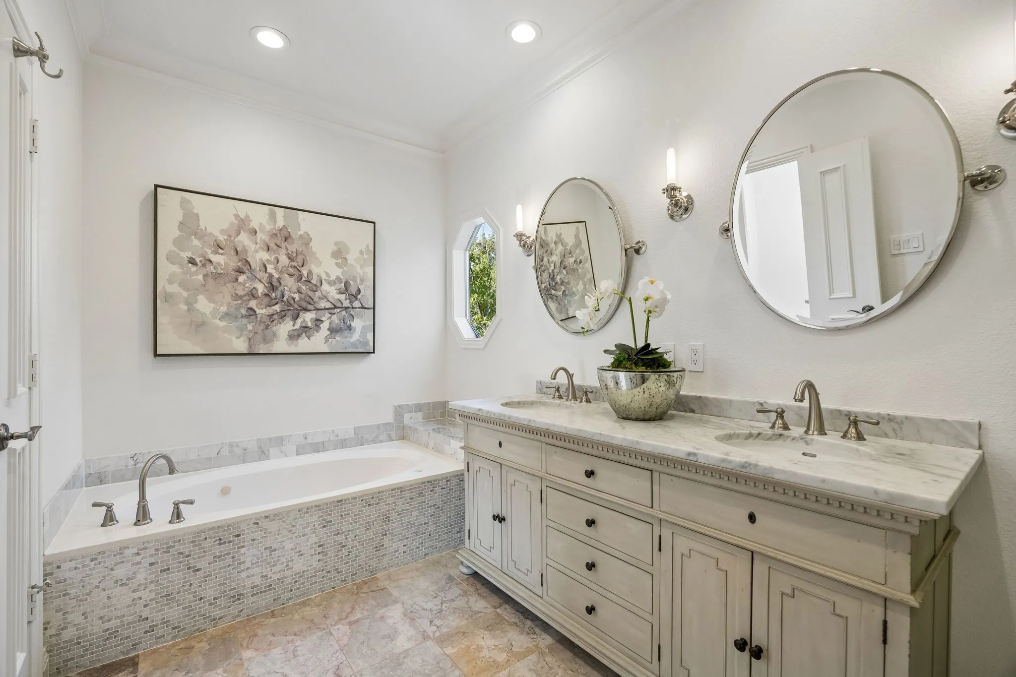 Restoration Hardware vanity with a marble countertop and dual sinks.