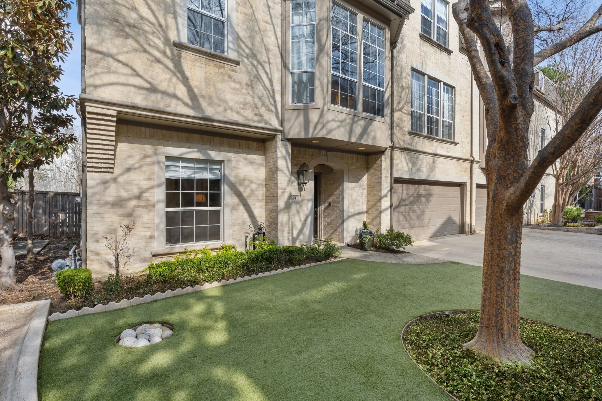 Turfed yard with updated landscaping.