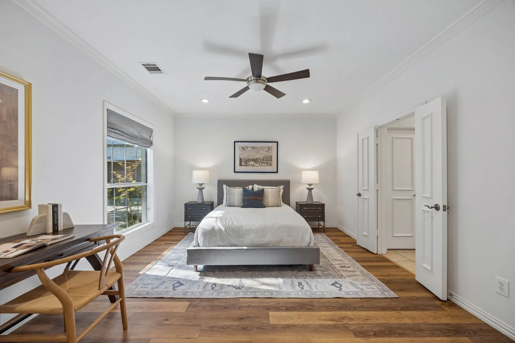 First-floor bedroom offers flexible use as a private guest suite or home office.