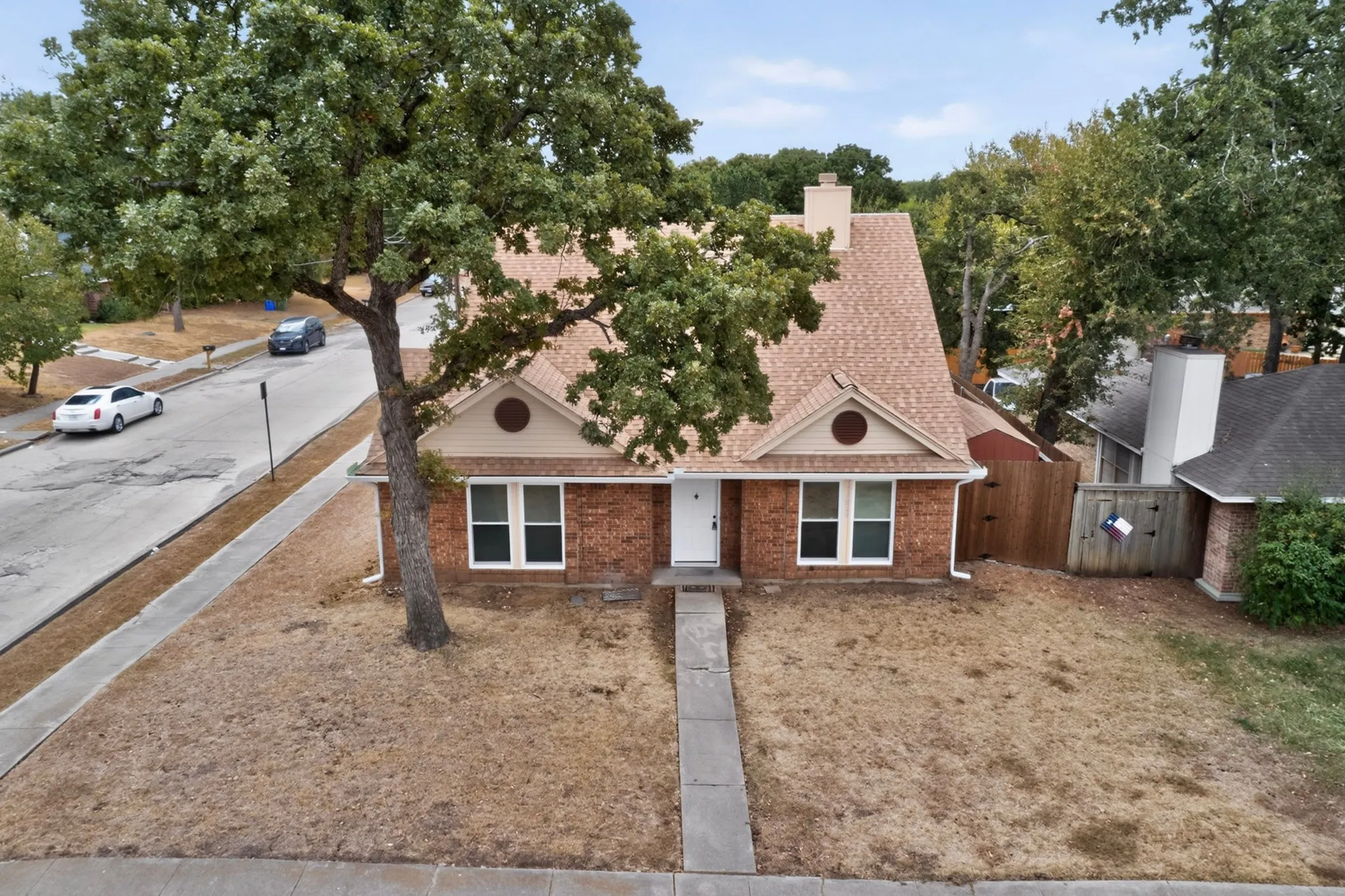 Traditional brick exterior with an A-frame roof and a prominent chimney