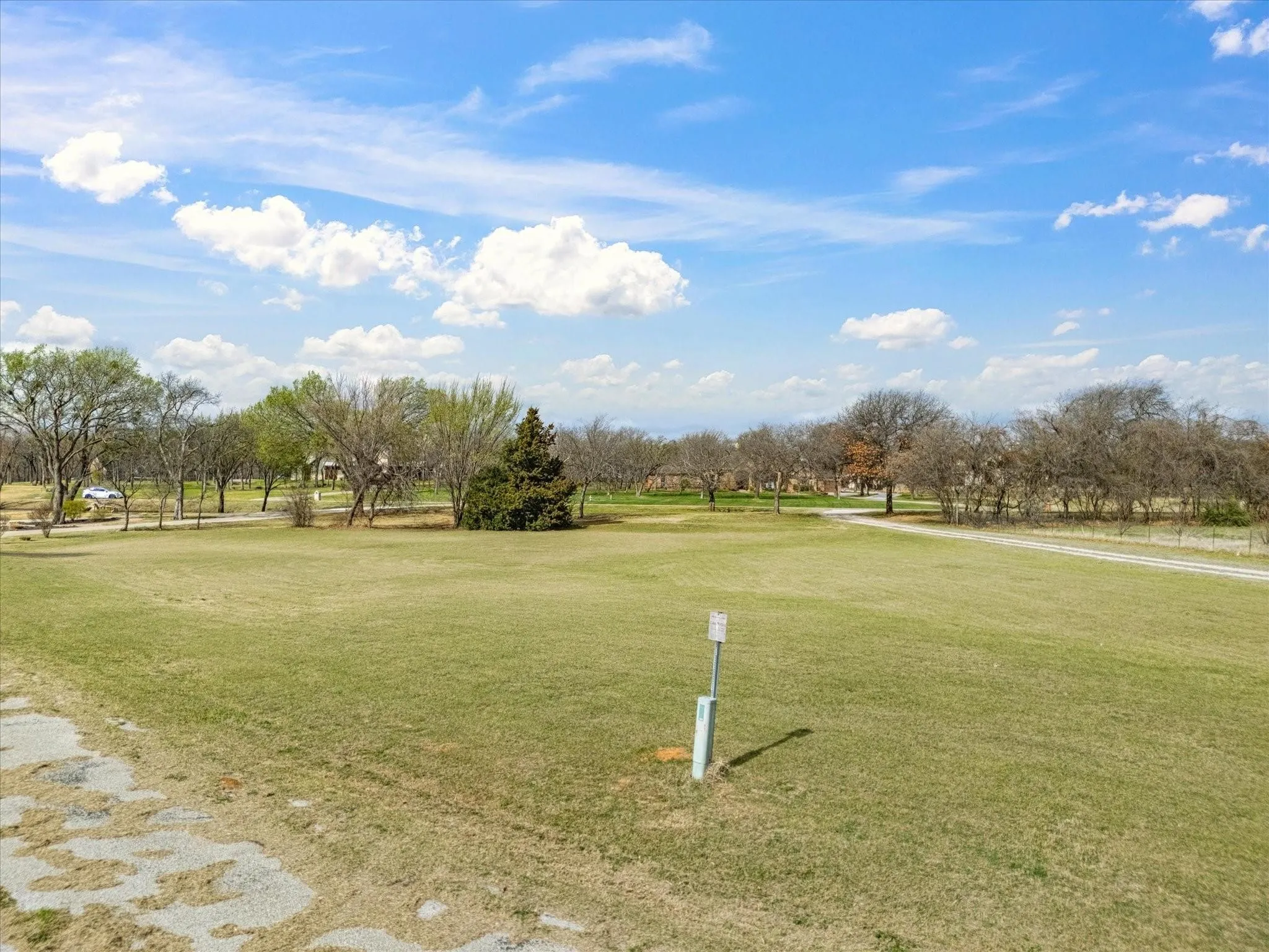 Expansive green space with perimeter trees