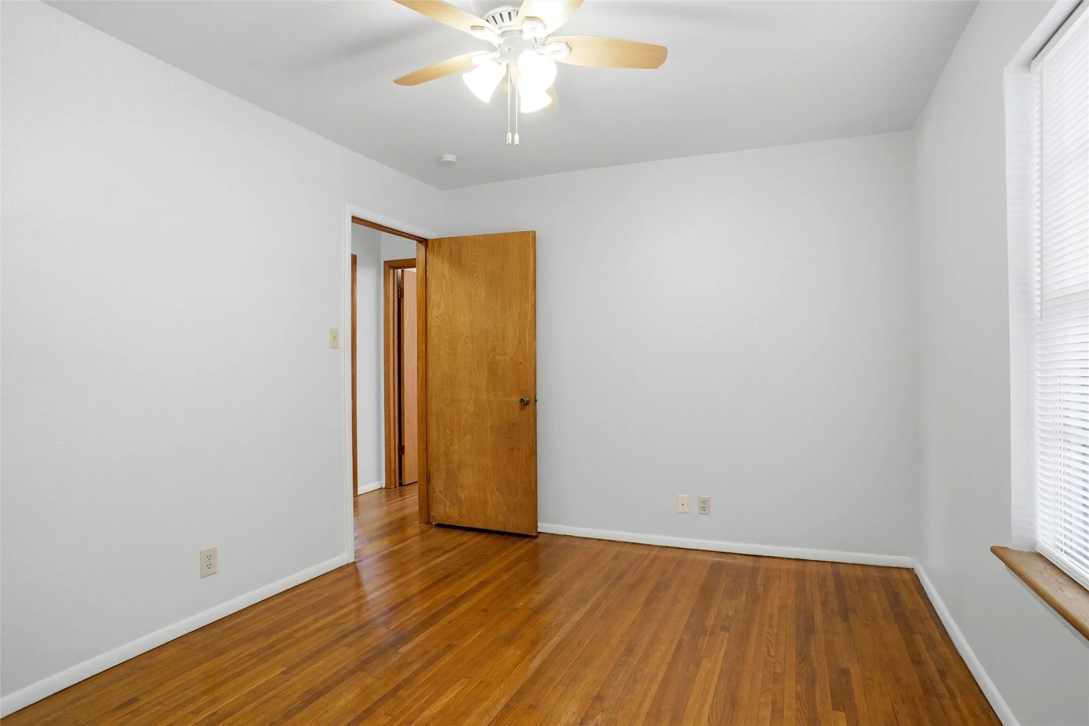 Refinished Hardwood floors, new Hunter Ceiling Fan & fresh Paint.