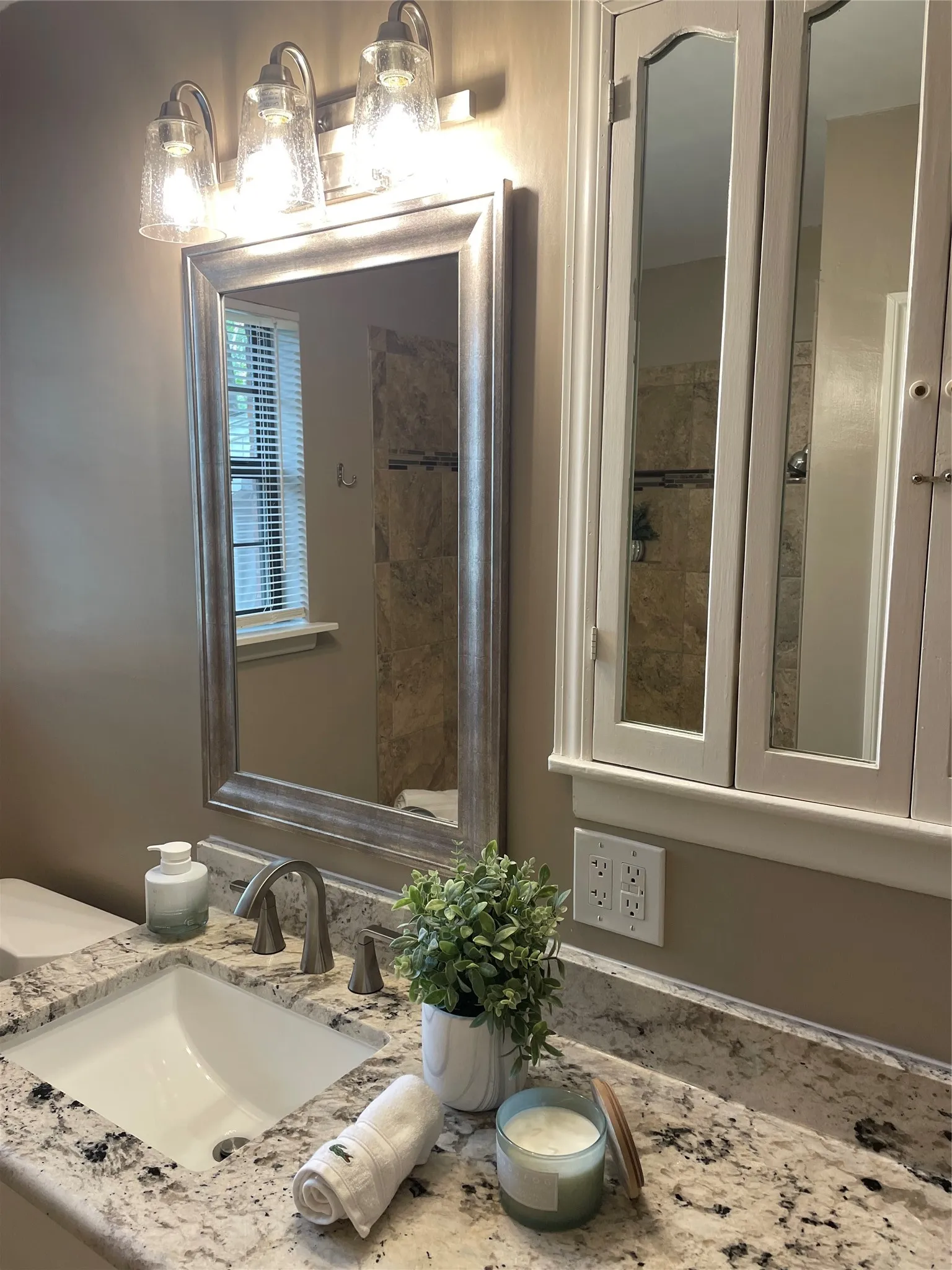 'White Cloud' Granite, Rectangle Sink, Delta Lineax Faucet & Craftmade Lighting