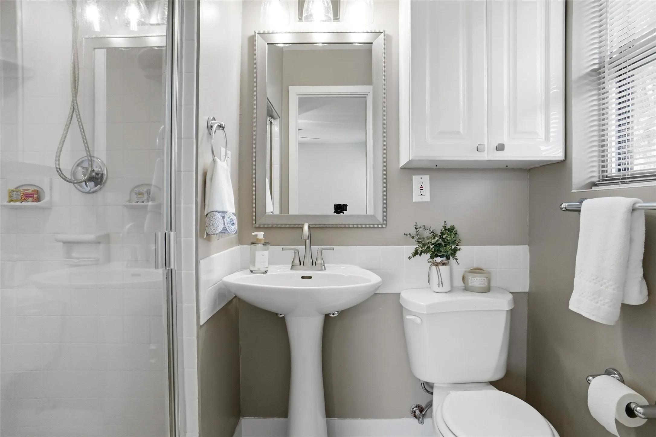 Updated Master Bath.  New Quorum Light, Mirror & Delta faucet .  Tile Shower & Floor have fresh grout.
