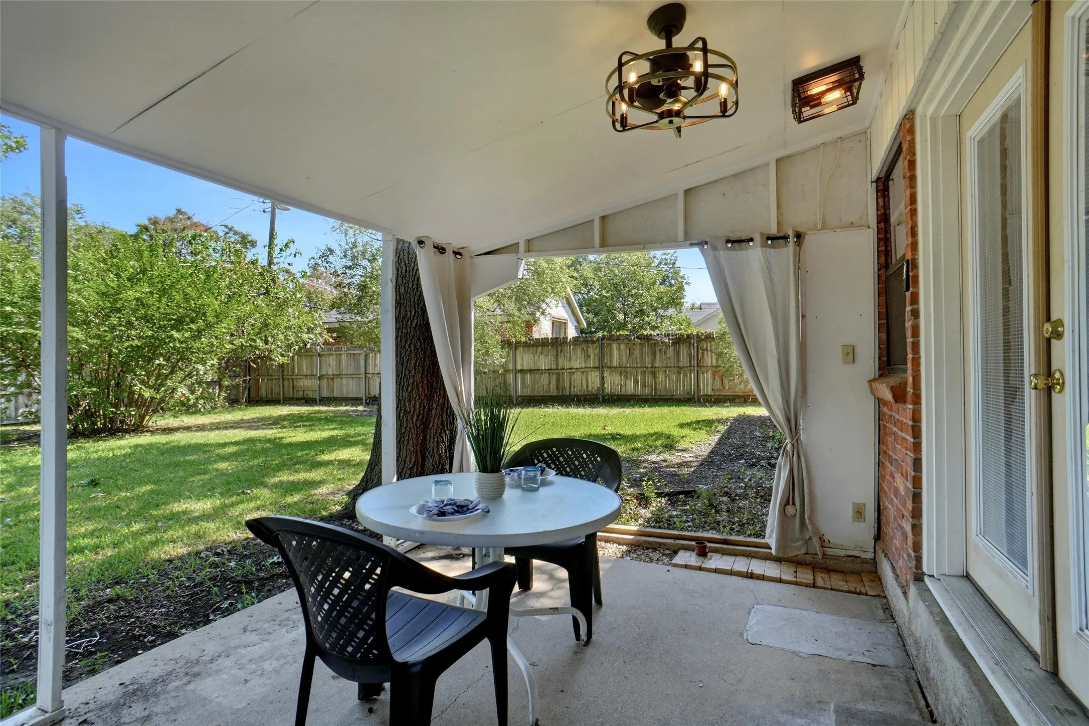 Refreshed back patio with New Chandelier Fan & flush mount Lights.