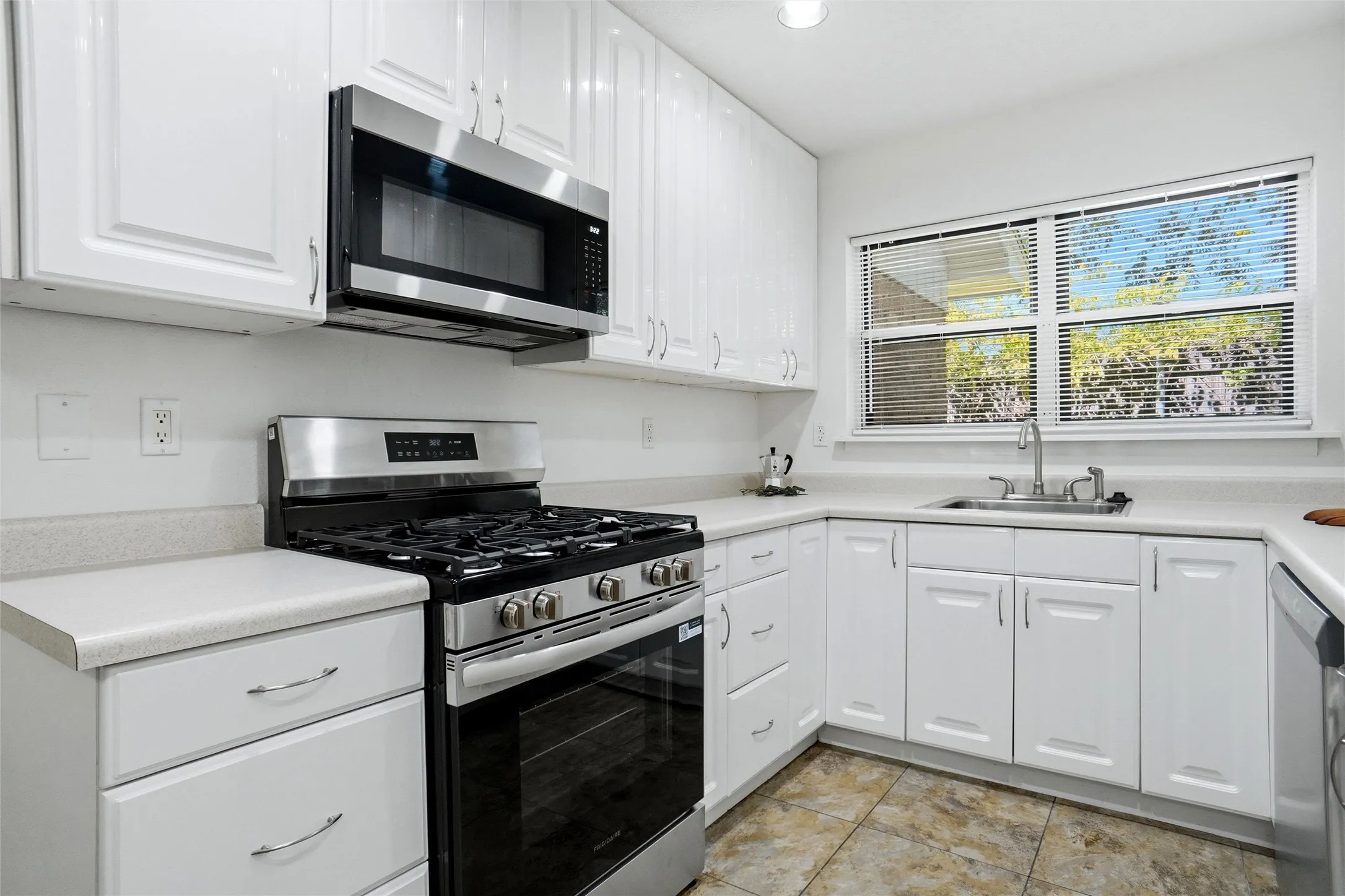 New Stainless Gas Range, Microwave & Dishwasher