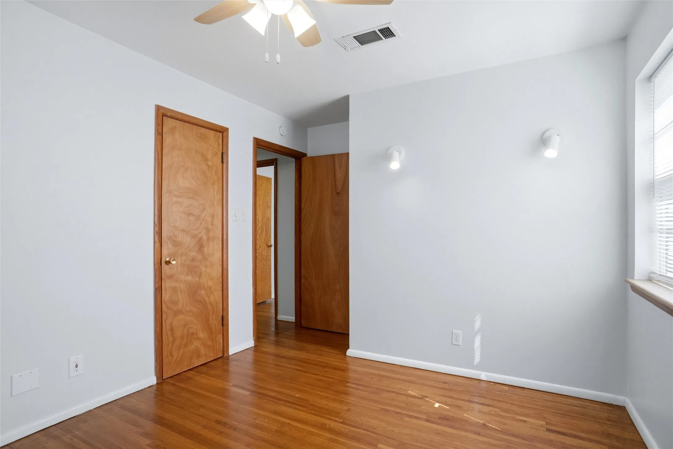 Refinished Hardwood Floors, Fresh Paint, New Hunter Ceiling Fan. Accent Spot lights & 2 roomy Closets.