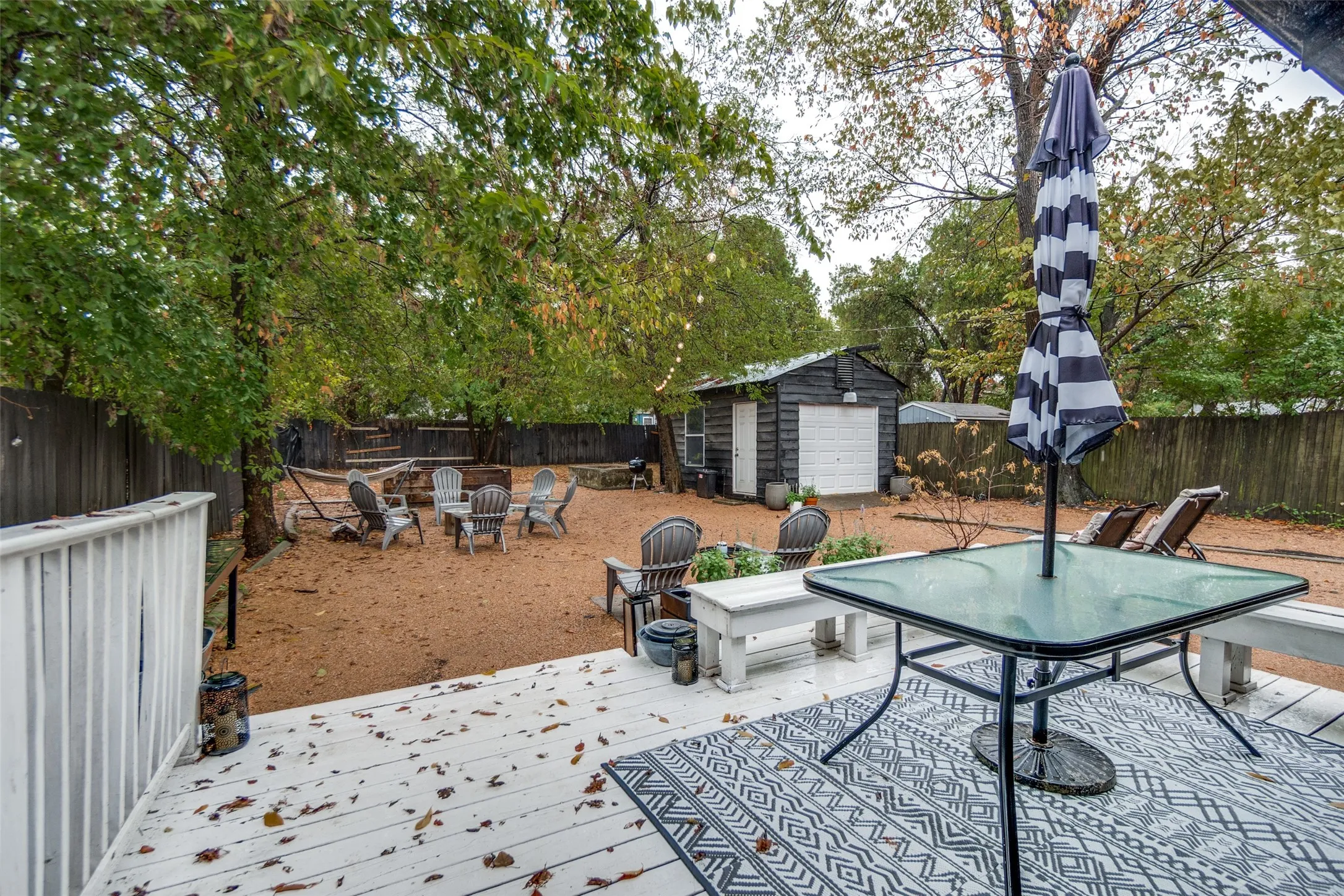 Spacious outdoor deck with painted wood flooring and white railings