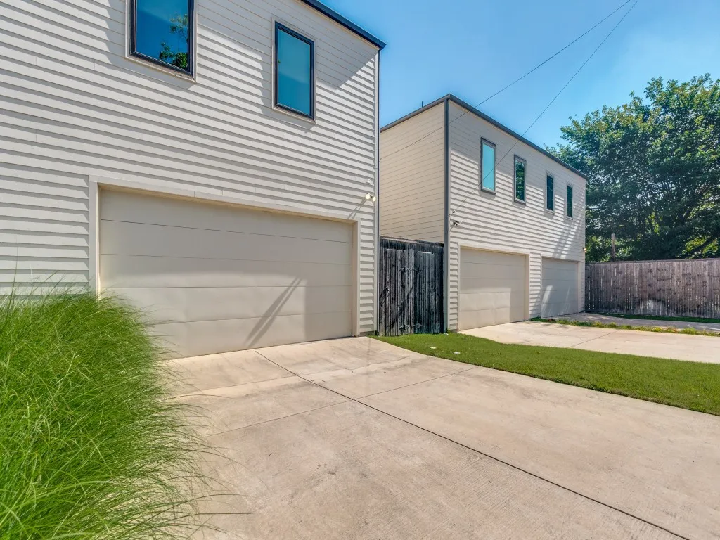 Two-story structures featuring horizontal siding and multiple garage entrances