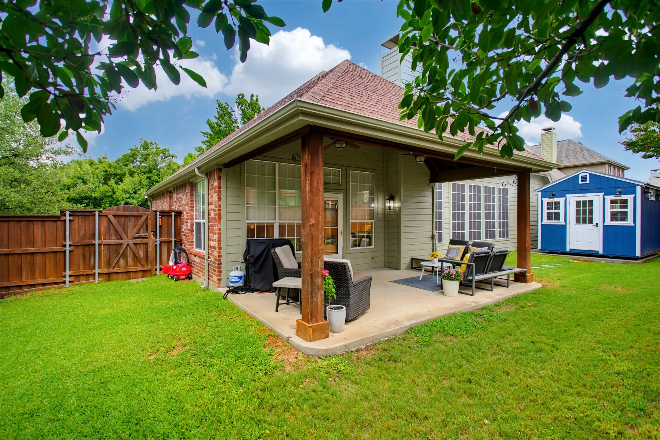 gorgeous covered patio with plenty of grassy area