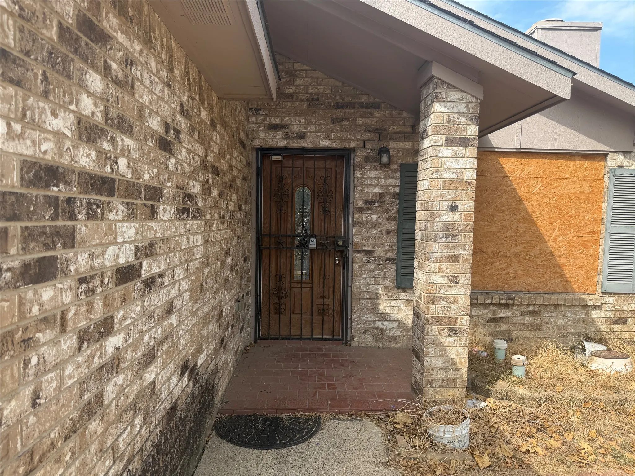 Brick exterior with a covered entry