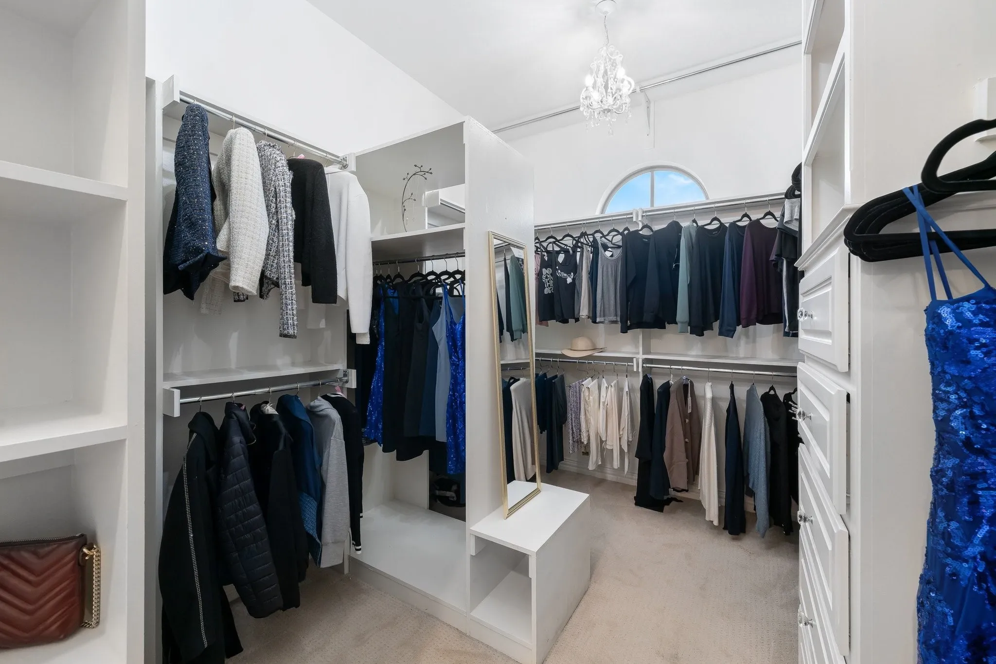 One of two large walk-in closets located in the primary bedroom suite.