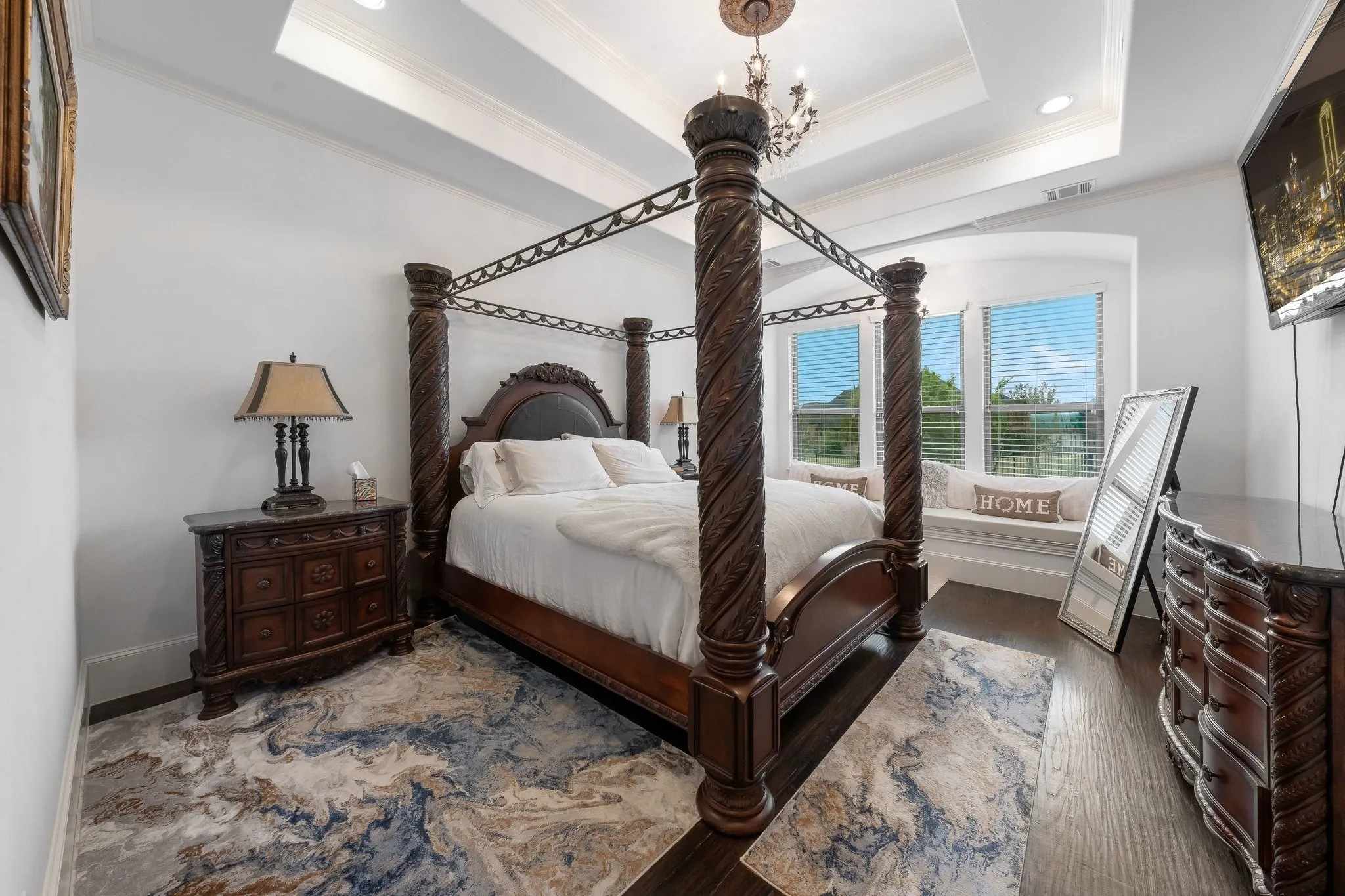 Large primary bedroom is part of a large primary suite which includes large sitting area, master bathroom, 2 walk-in closets and exquisite finishes.
