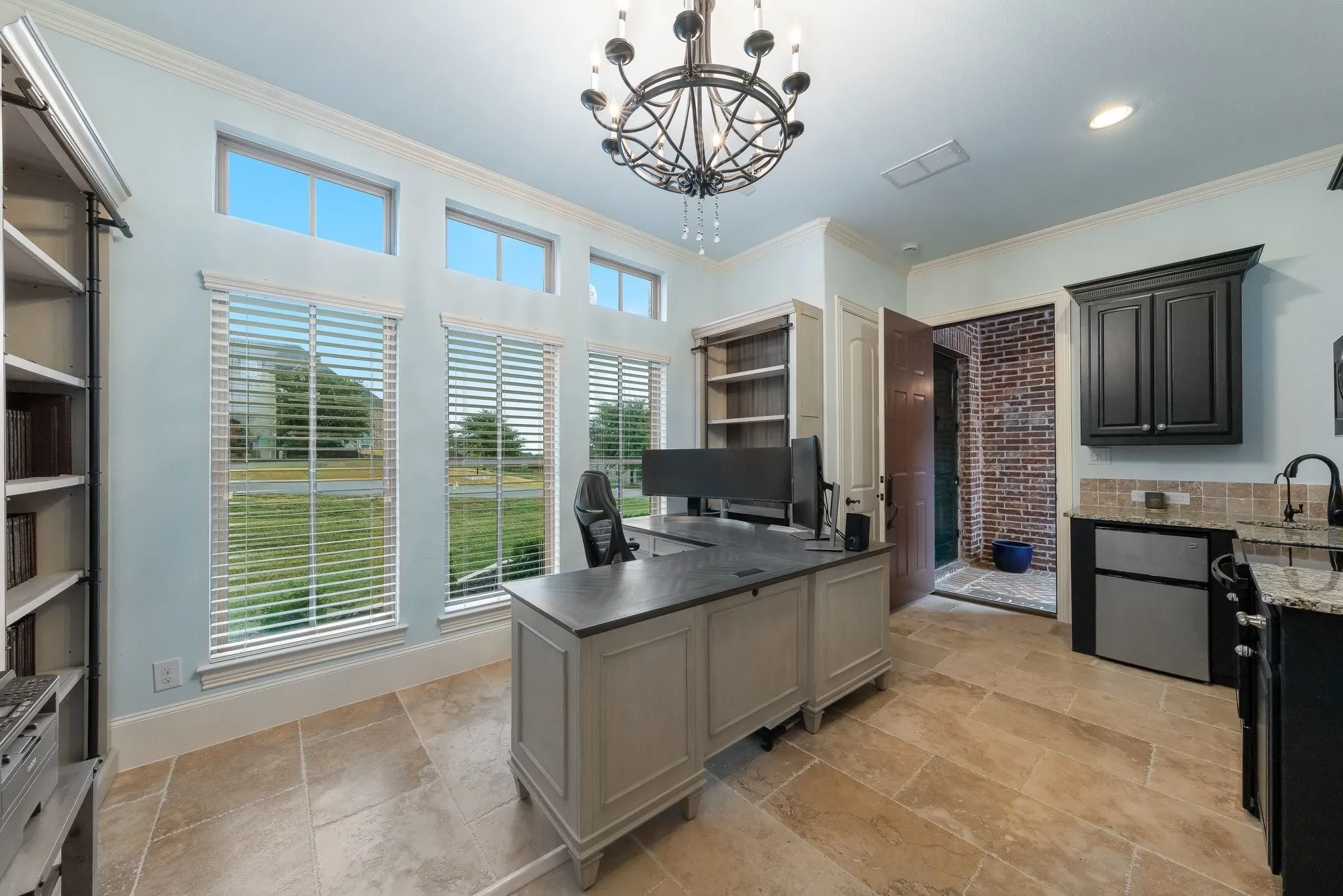 Guest suite with kitchen is currently used as a home office.