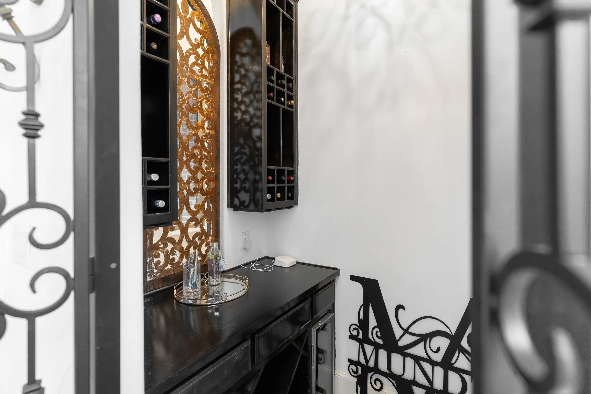 Service bar is located of the main living room at the home entry.
