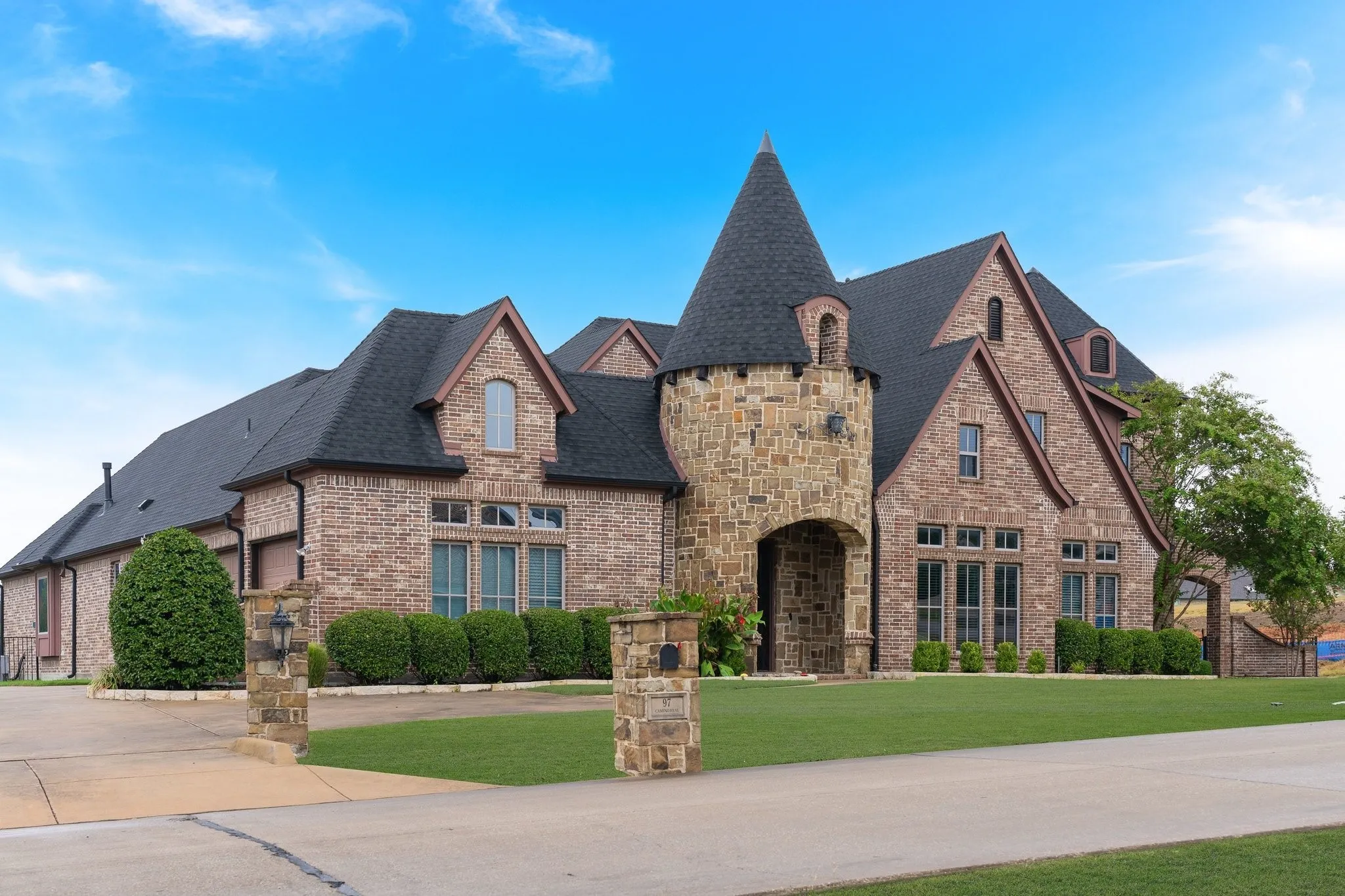 Oversized 3-car garage and extra parking pad.