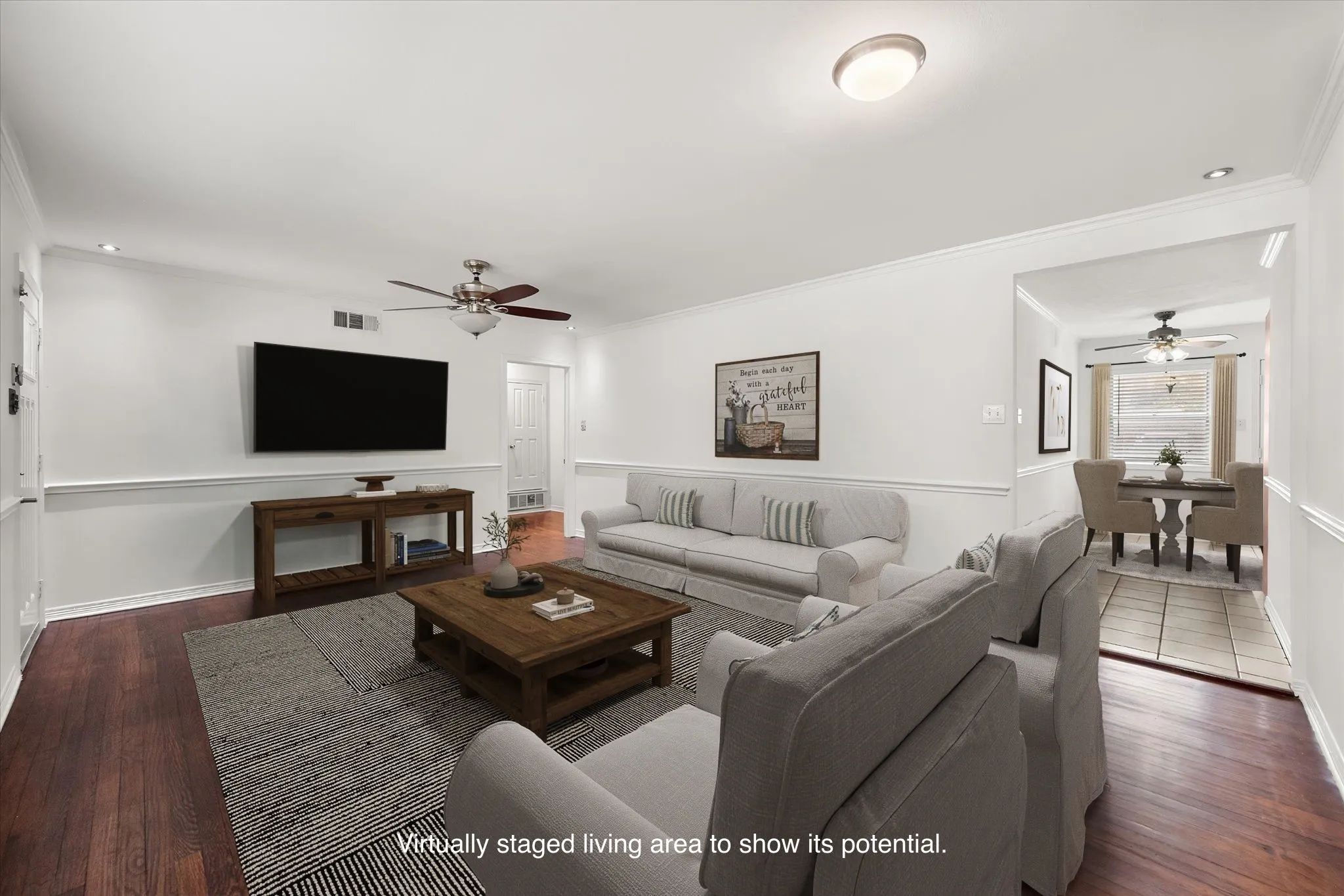 Wood-finish flooring, ceiling fan, recessed lighting, and crown molding
