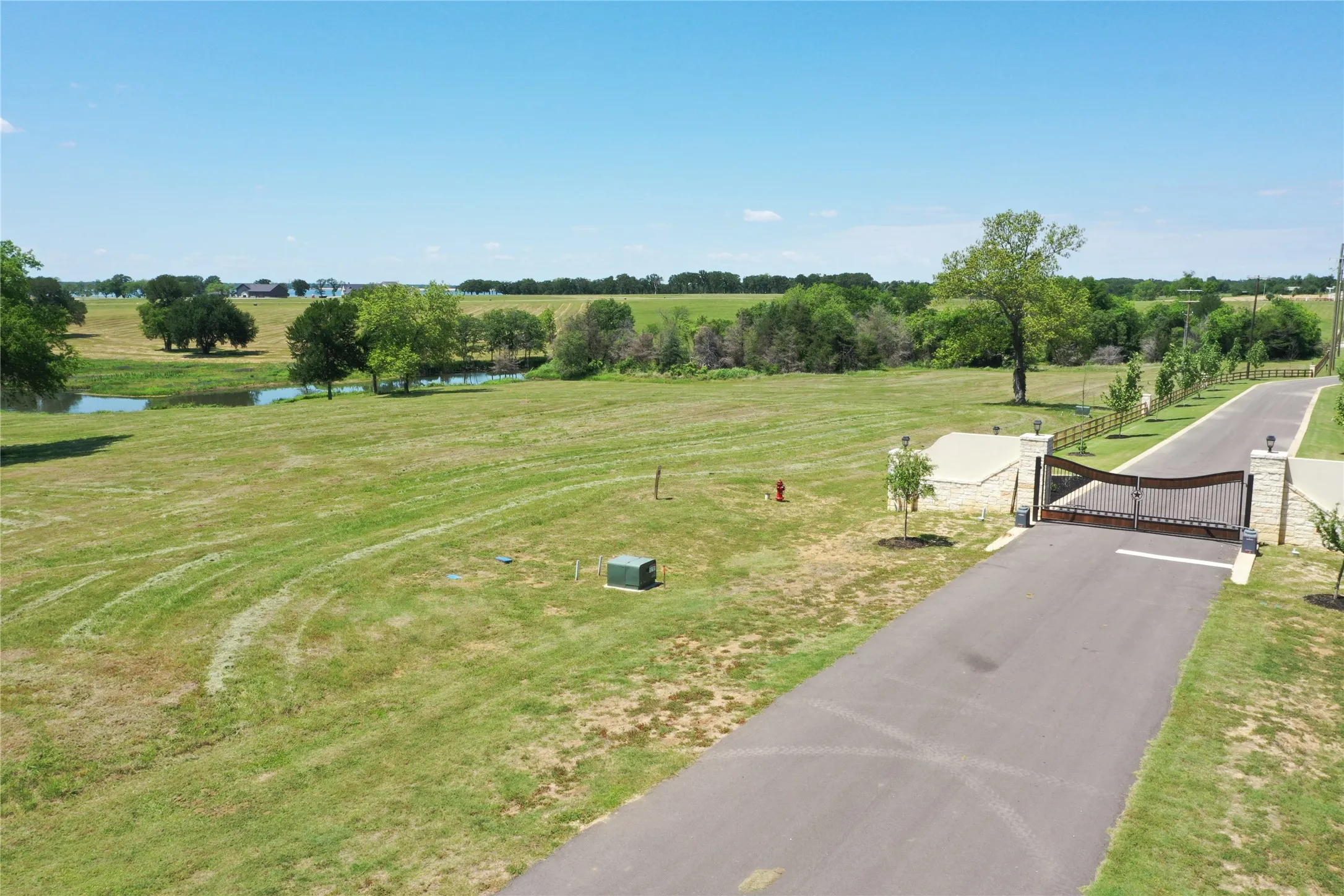 The Shores gated entrance showing lot and available utilities