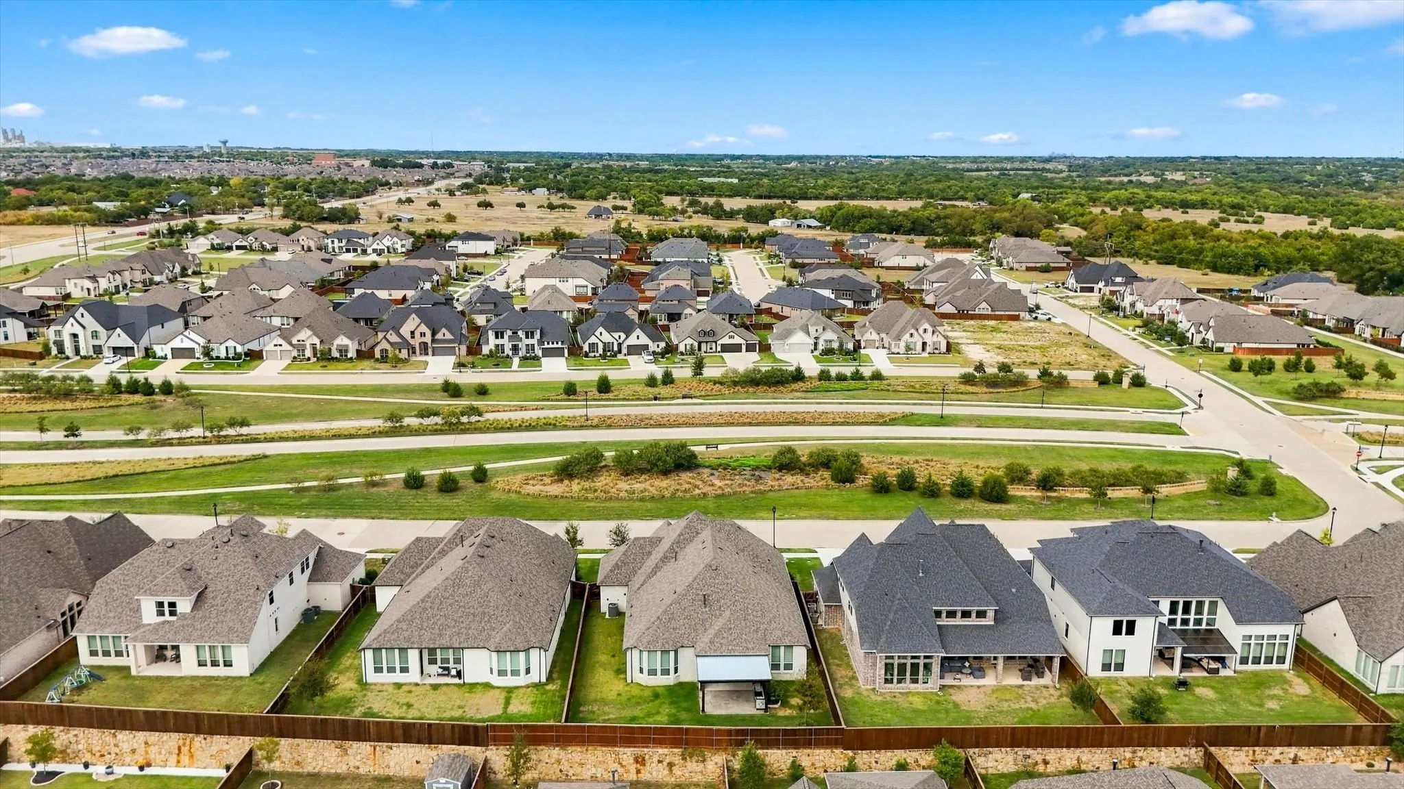 Home sits at the high point in the neighborhood across from greenspace.