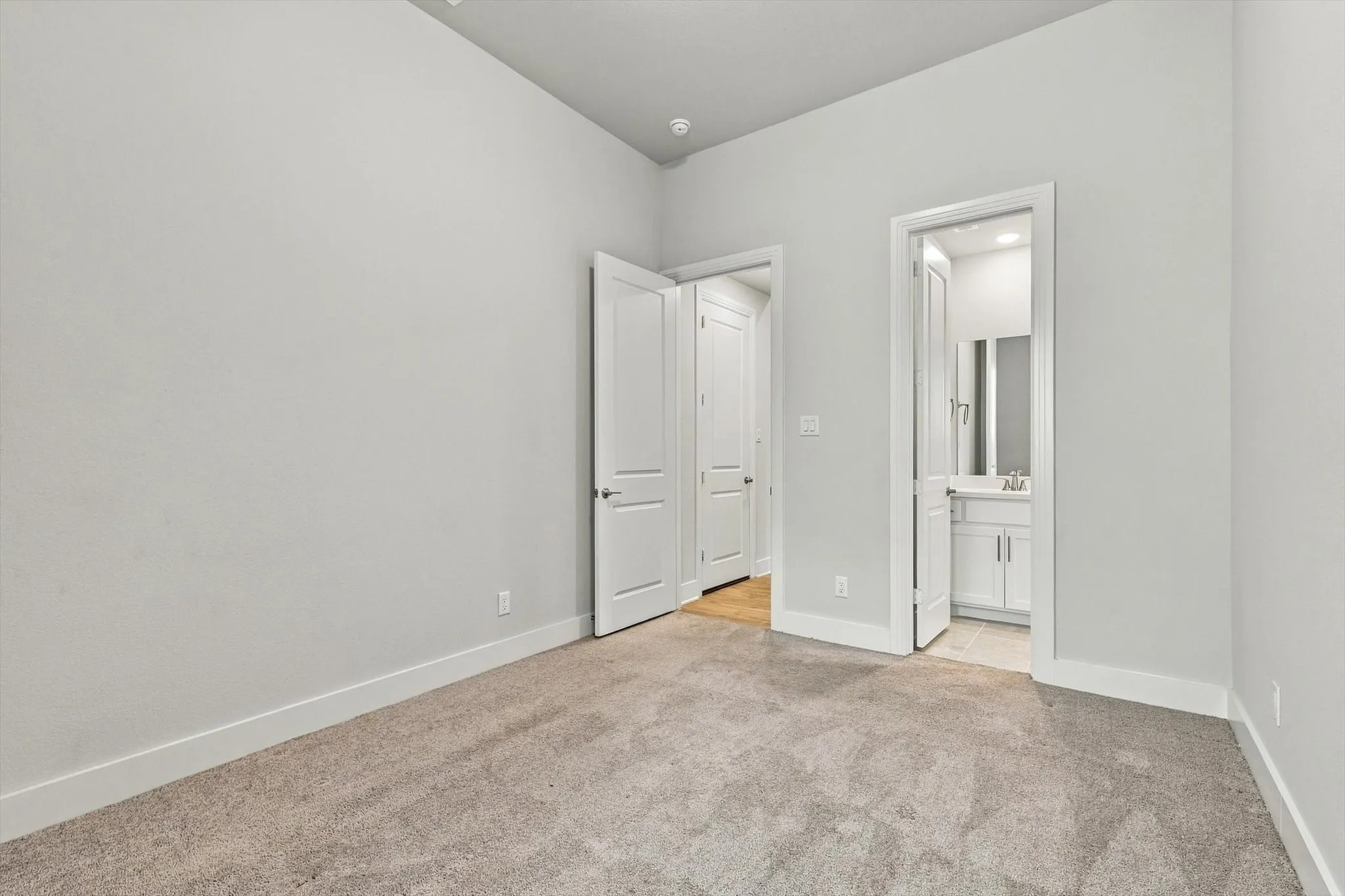 Guest Bedroom 1 with ensuite bath and walk in closet
