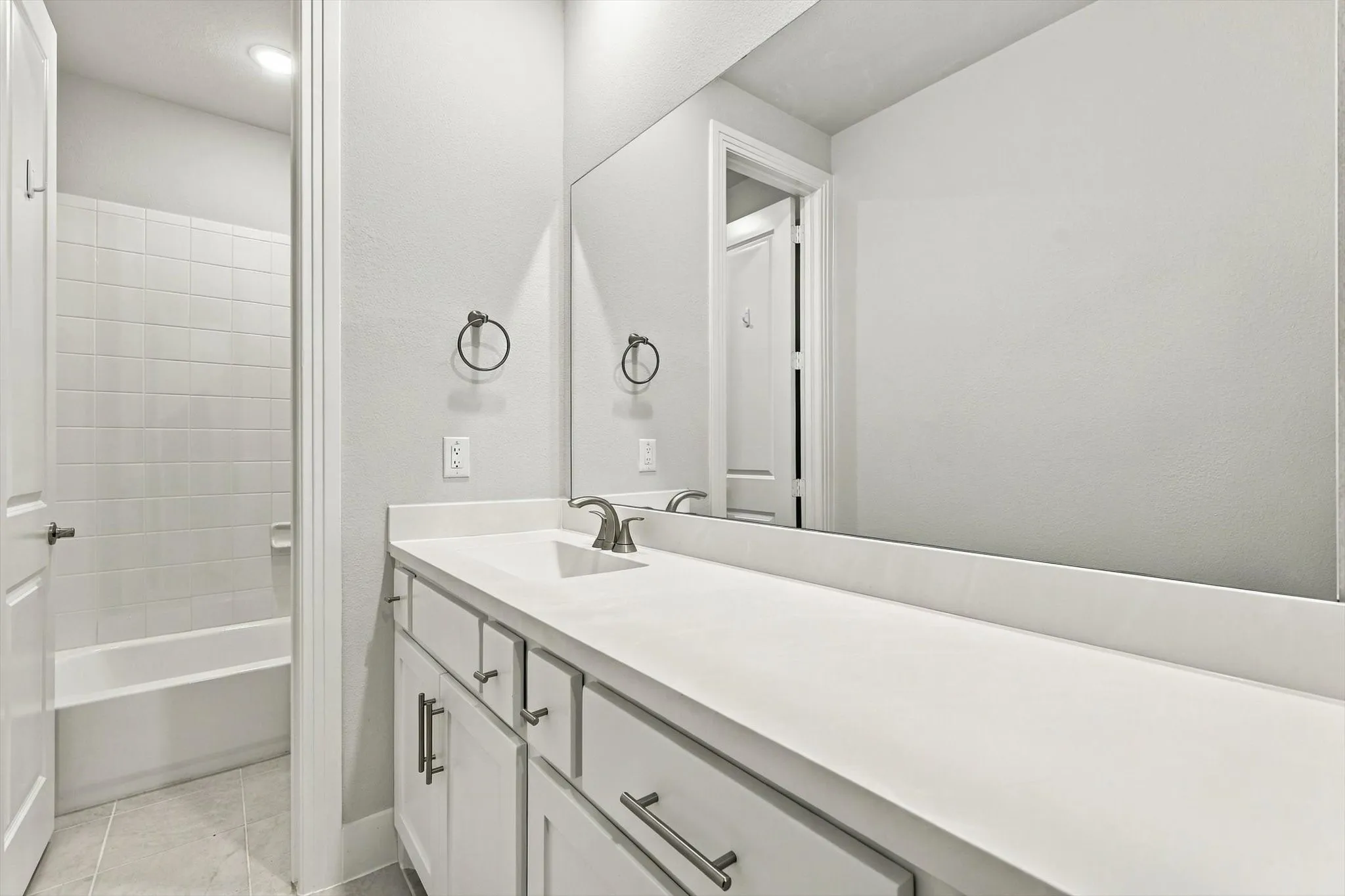 Guest bathroom with dual sinks.