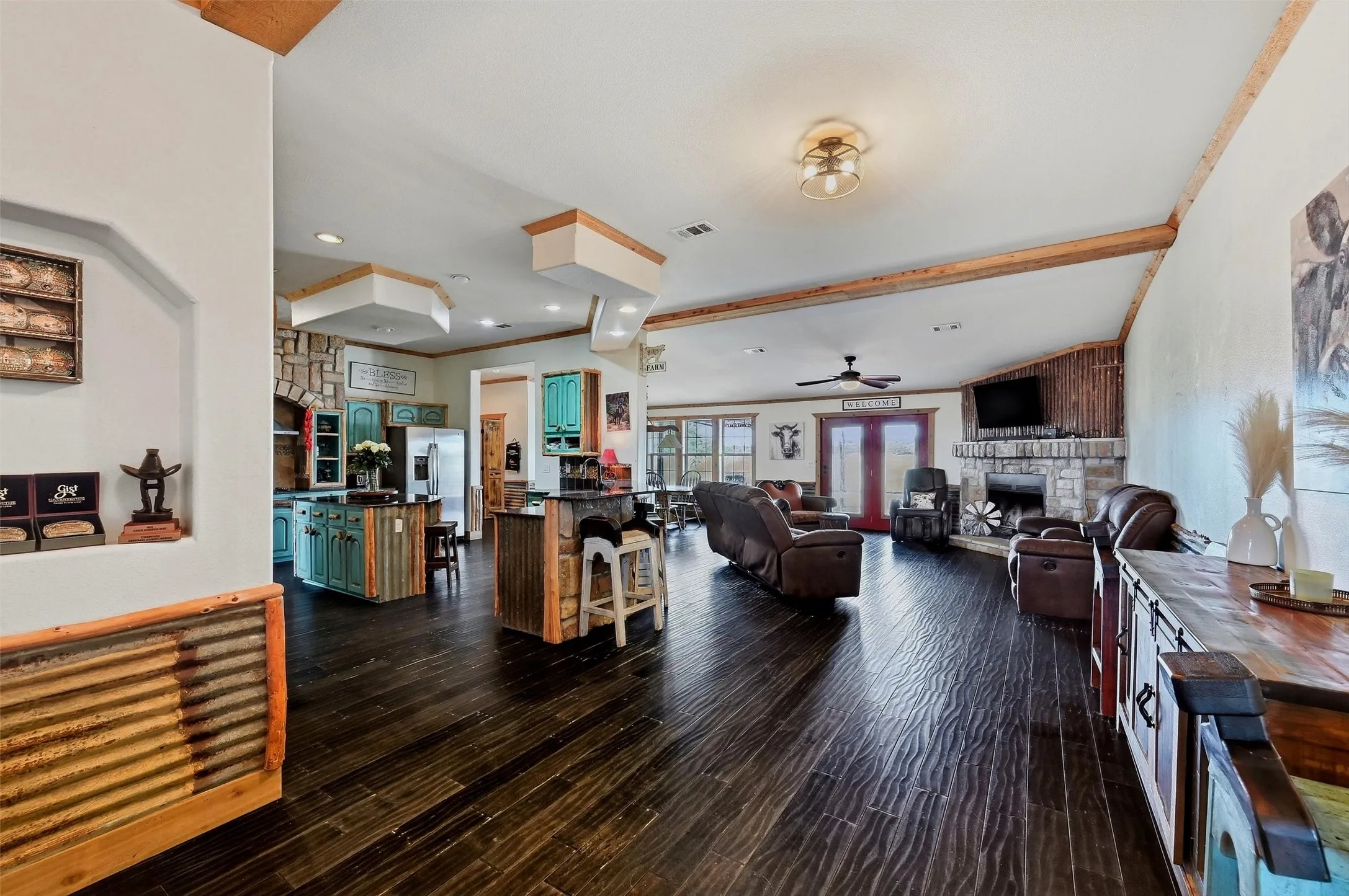 Triple-wide mobile home living area has an open floor plan.