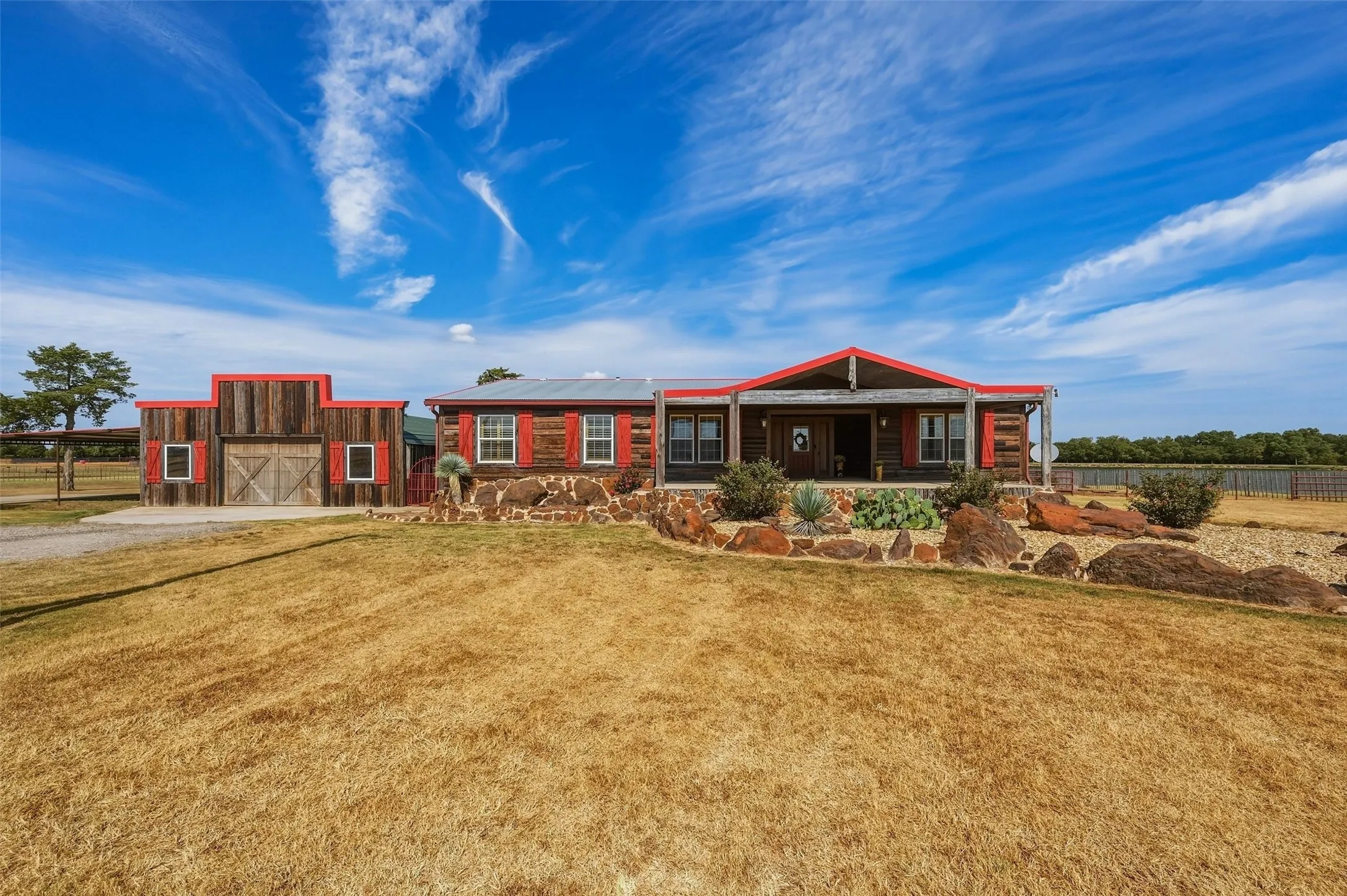 Front of the Triple-wide mobile home with adjacent garage.