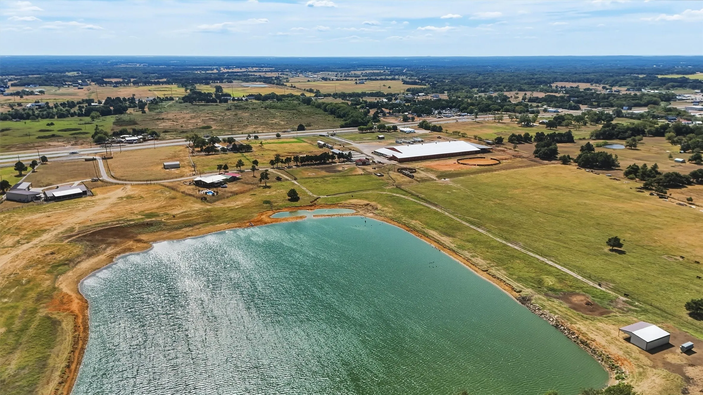 Large pond to the rear of Crossfire Arena and  the double-wide mobile home.