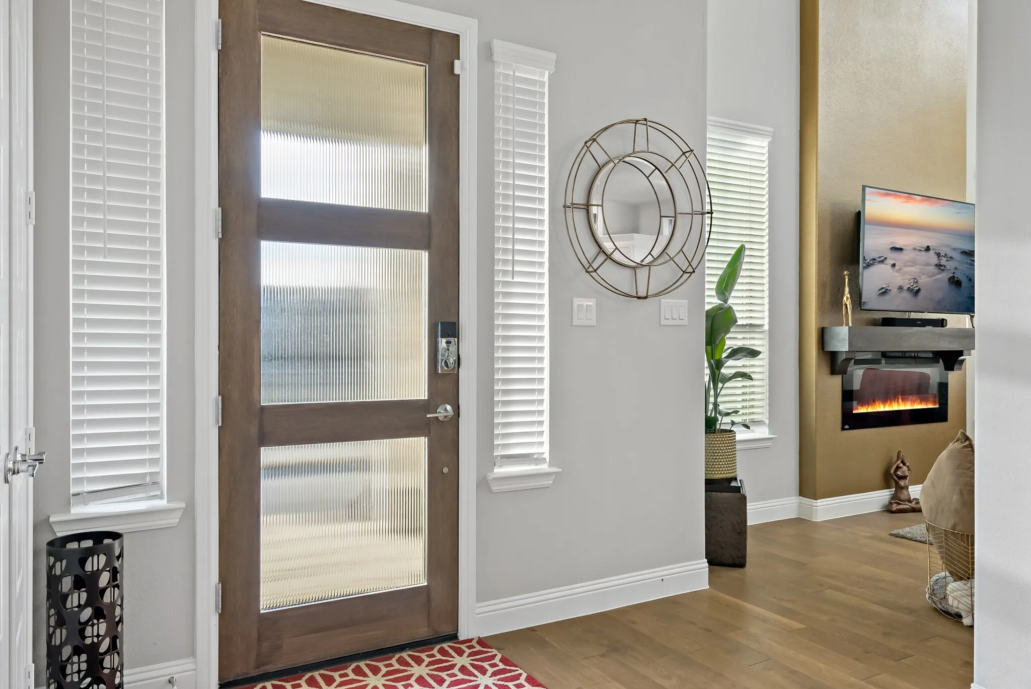 Warm wood-finish flooring extending into the main living space