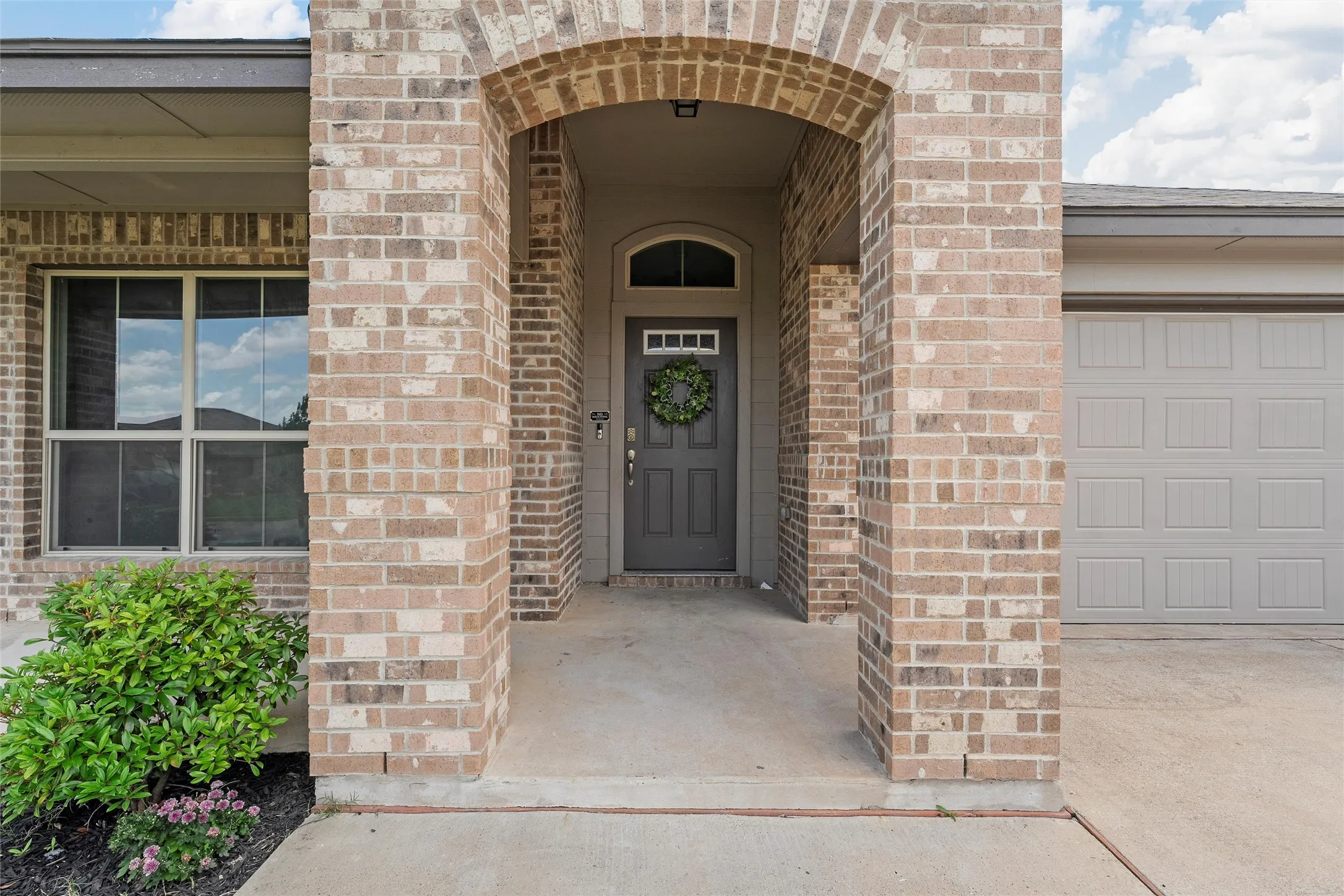 Entrance to property with brick siding