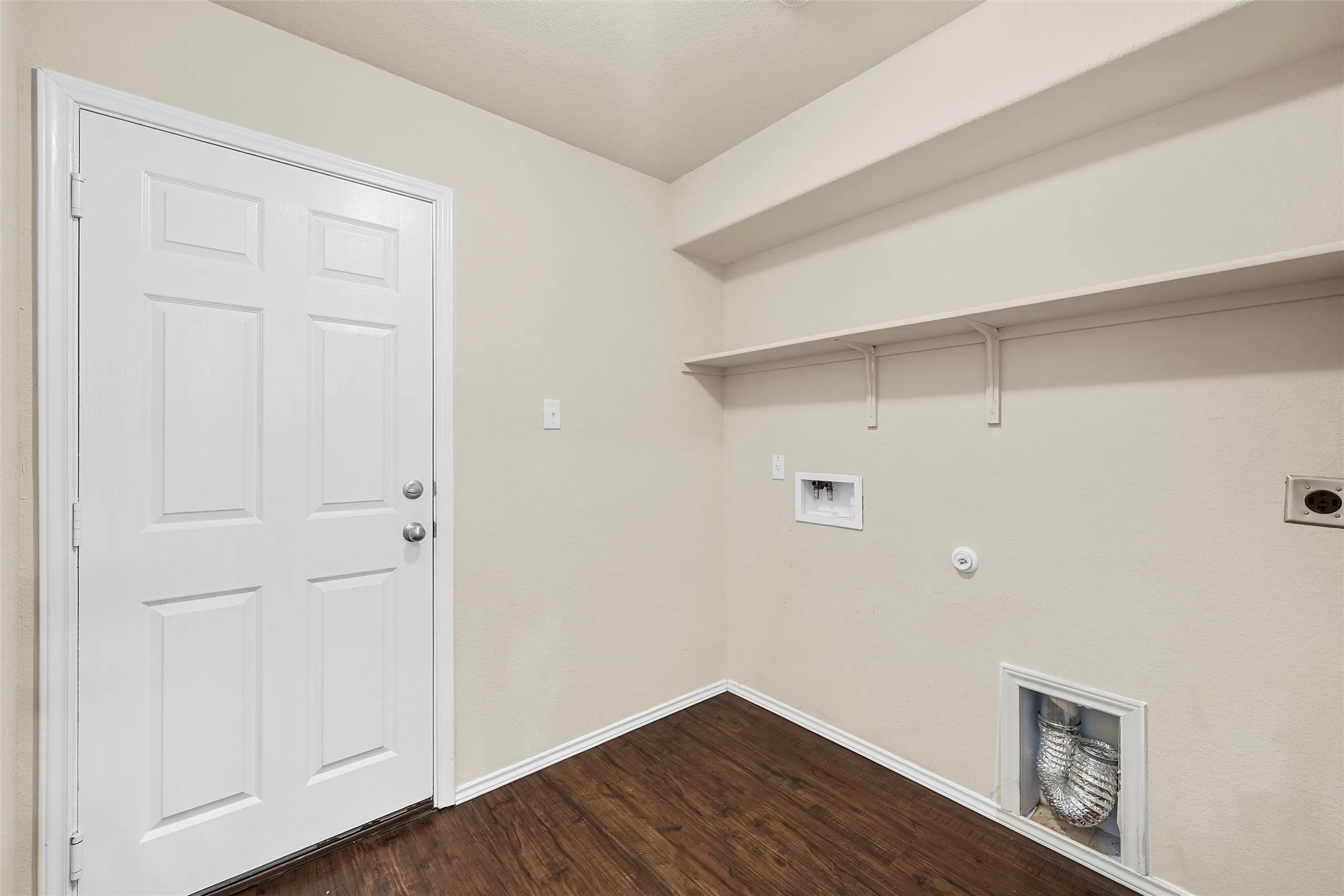 Laundry area featuring hookup for a washing machine, hookup for an electric dryer, dark wood-style floors, and gas dryer hookup