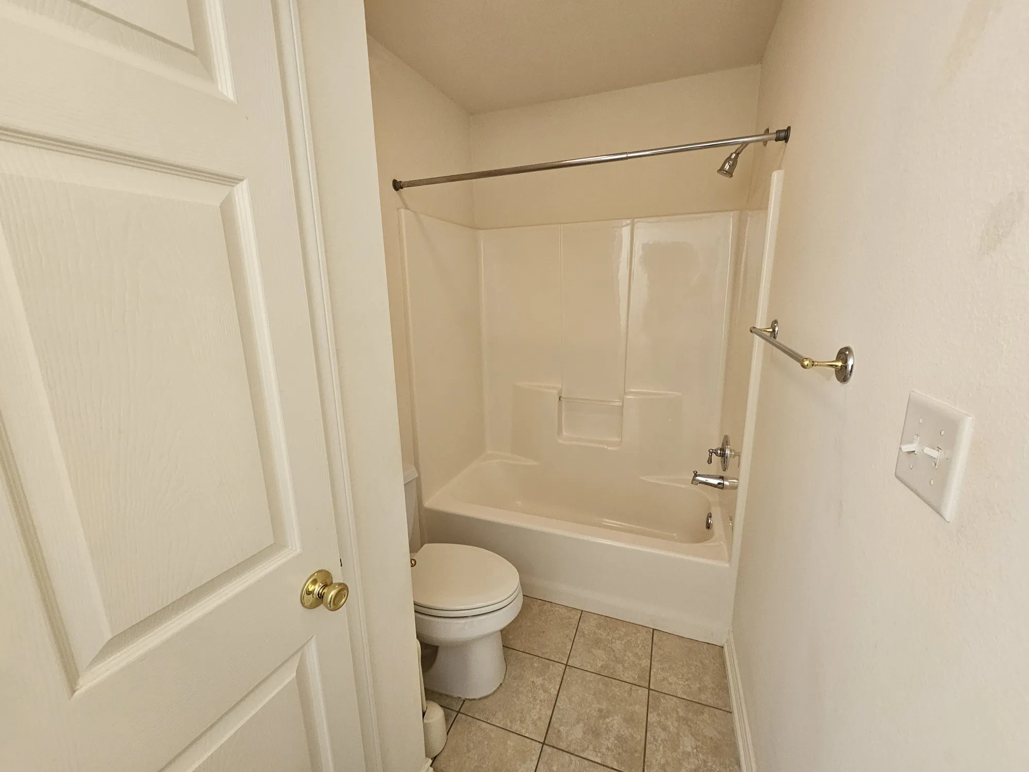 White paneled door with a brass knob