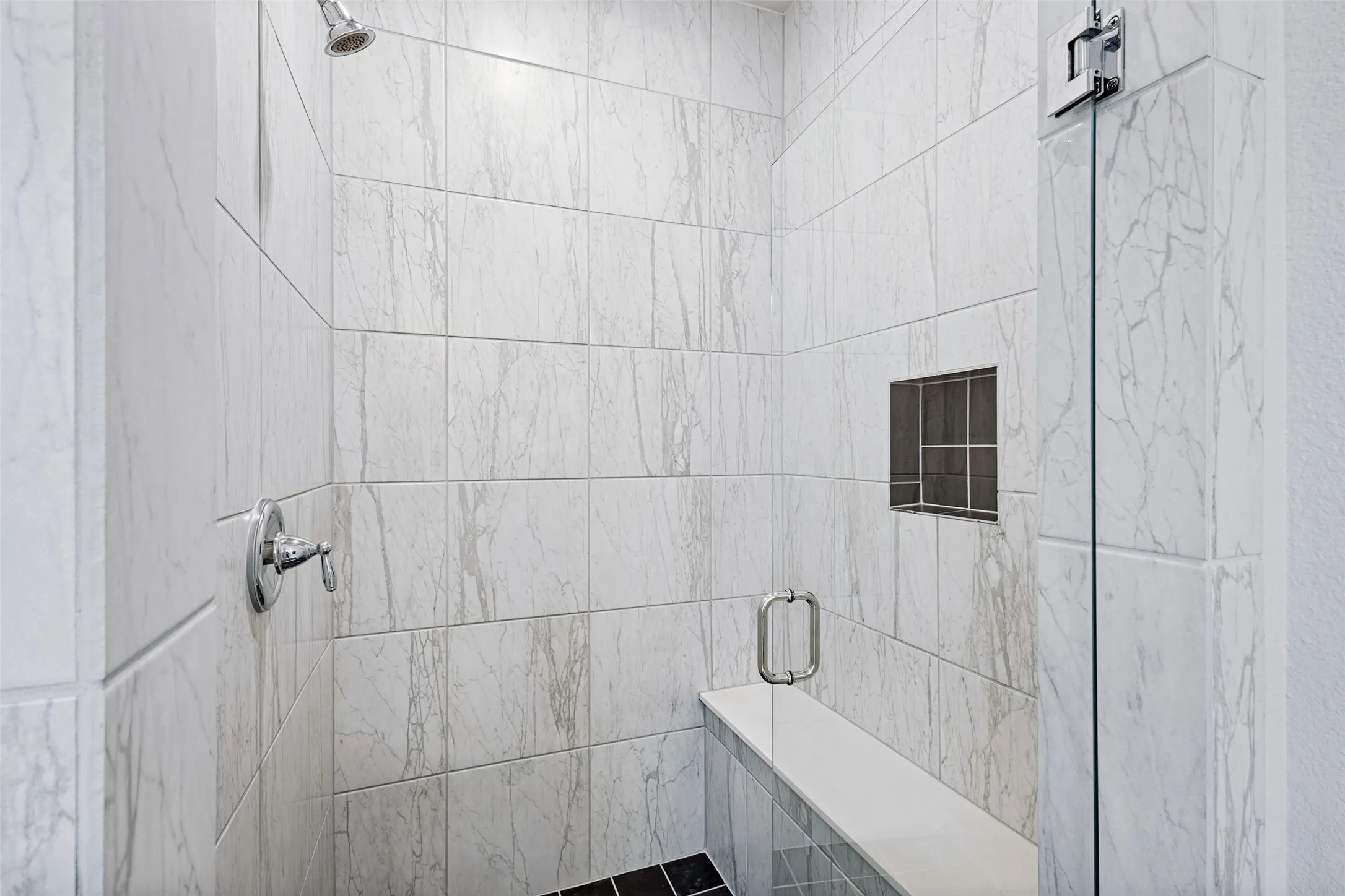 Primary standing shower with bench!