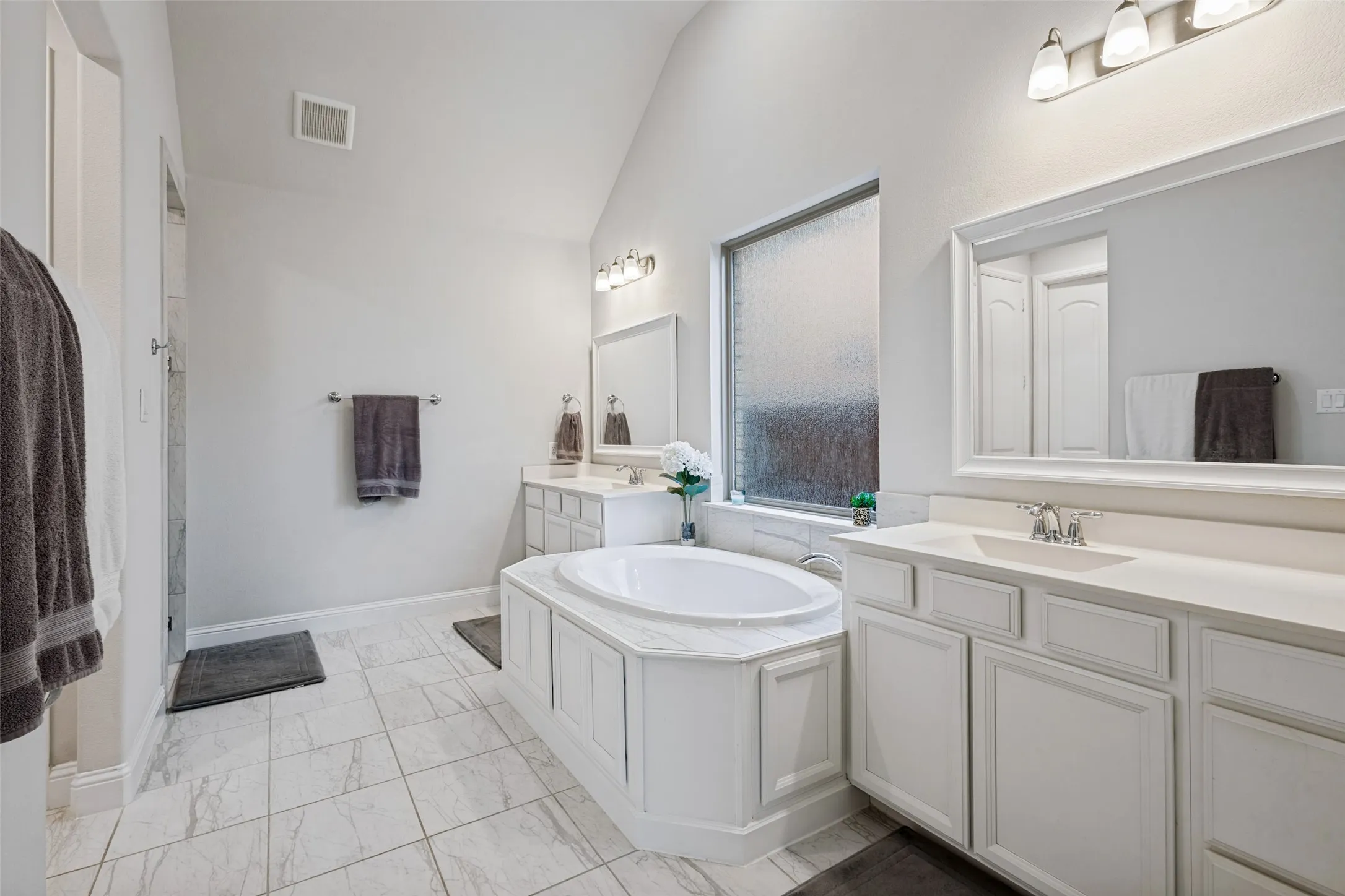 Toilet closet, separte shower, and bathtub
