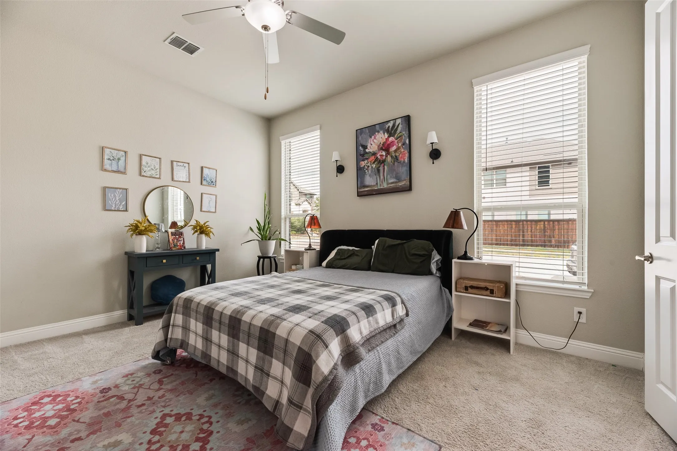 Recessed lighting, ceiling fan, carpet flooring, multiple windows with blinds, and a paneled door