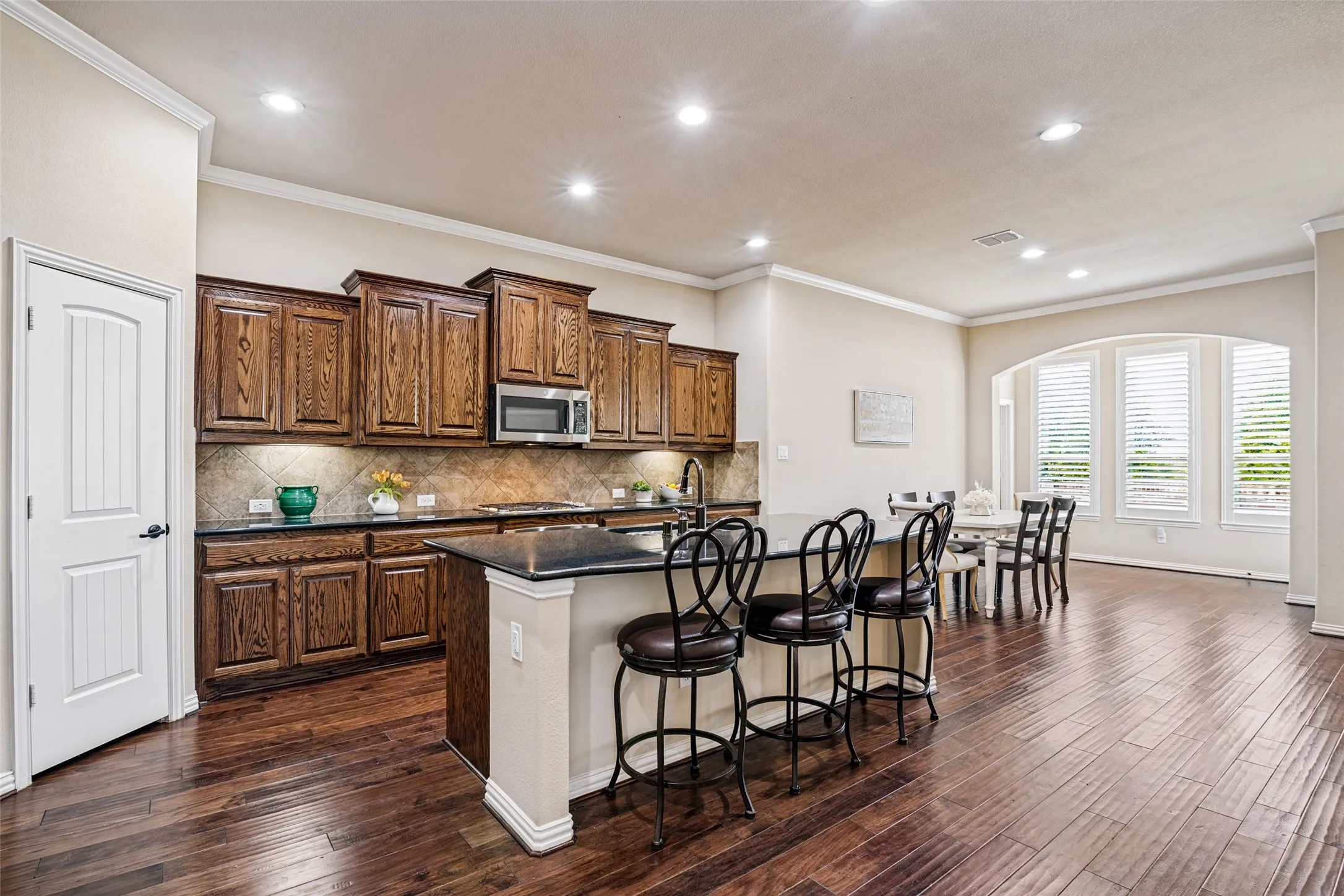 Stunning oversized Kitchen has Great Island, stainless appliances, including gas cooktop.