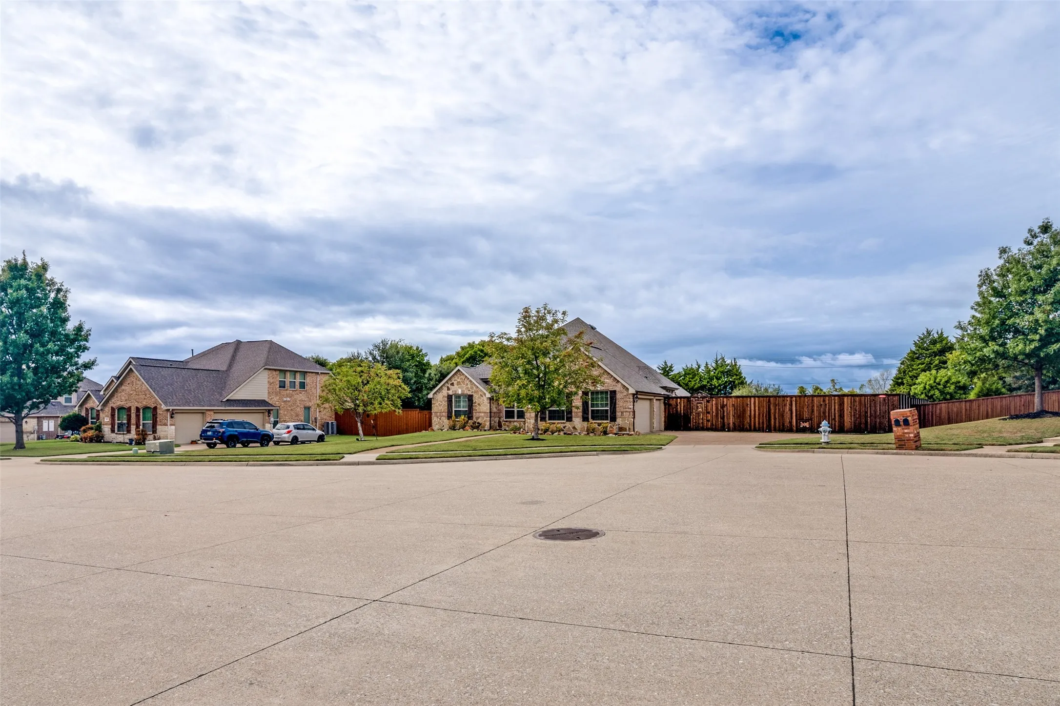 Home is located on a large cul de sac lot with large aggregate driveway