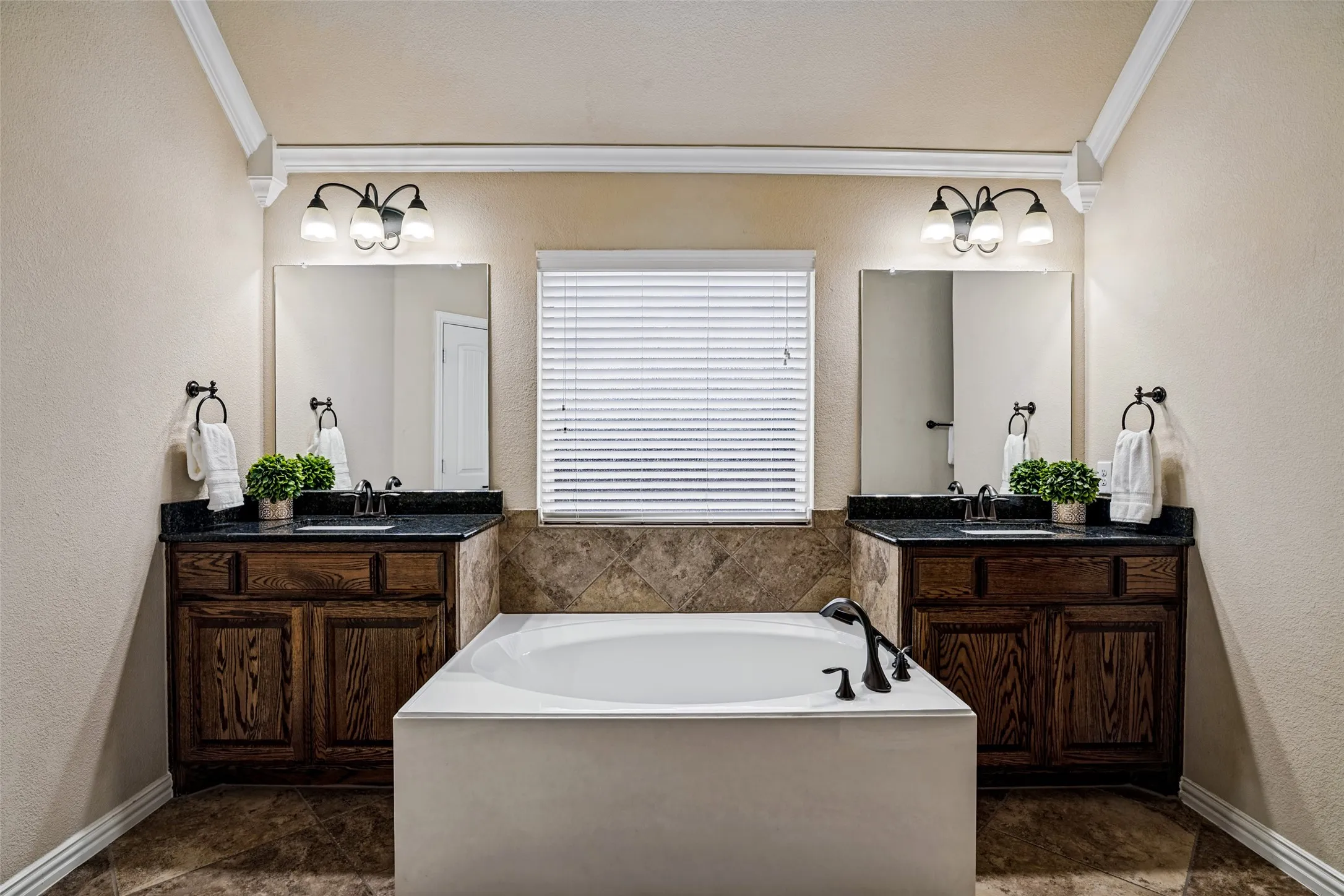 Dual vanities, large soaking tub, dual closets and separate walk in shower. Linen closet