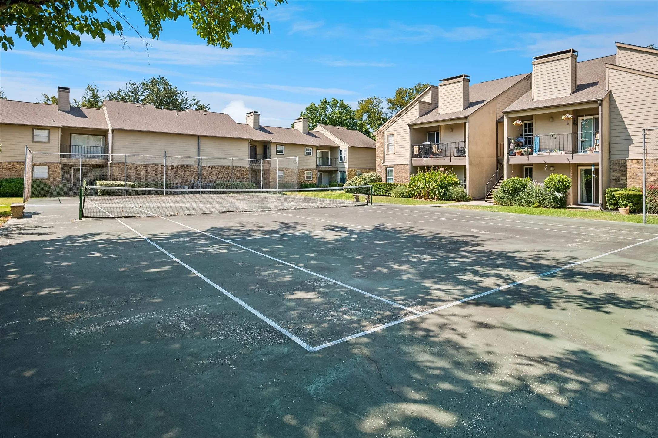 View of tennis court from living room and office