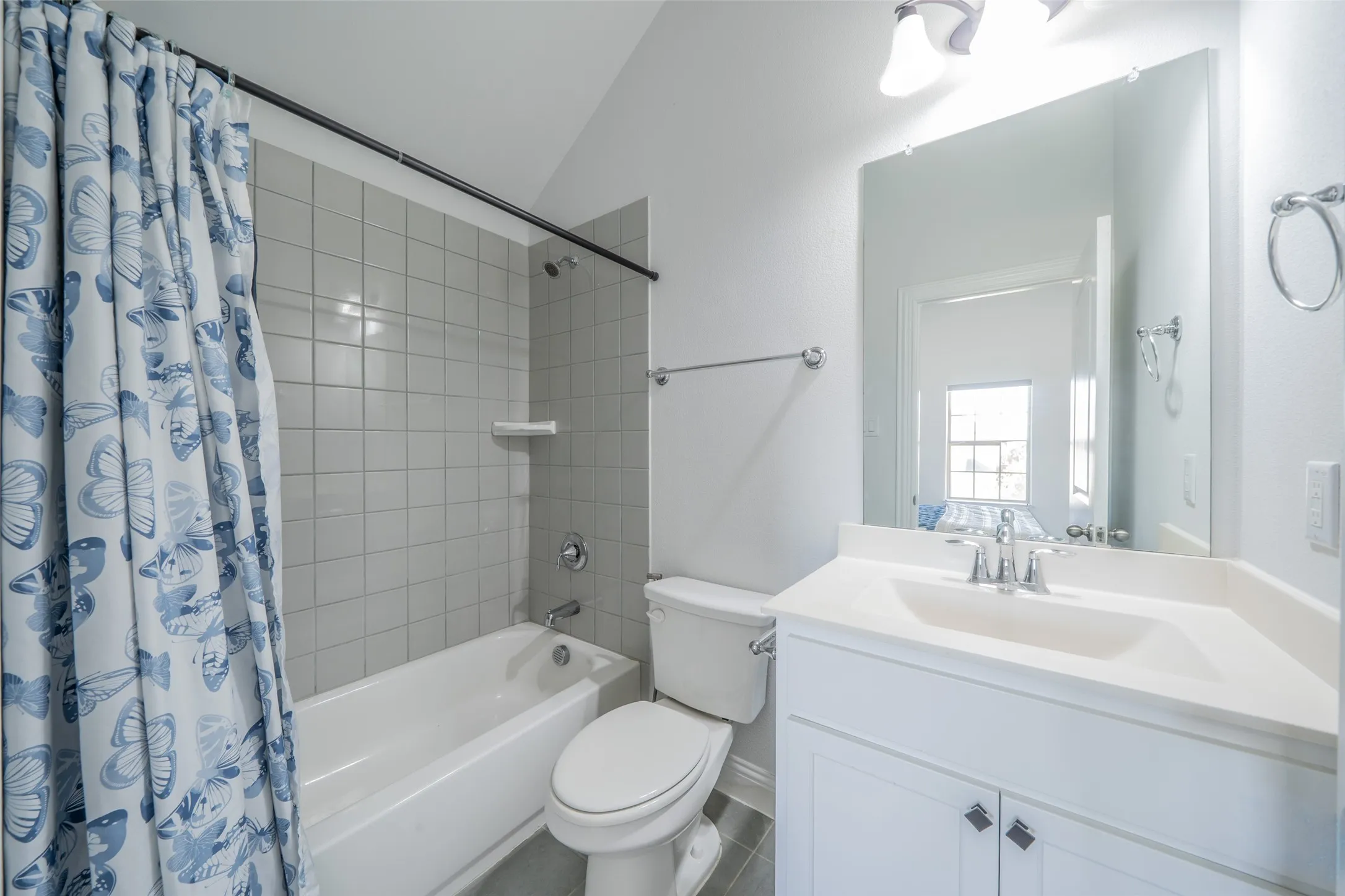 White vanity with an integrated sink and chrome fixtures