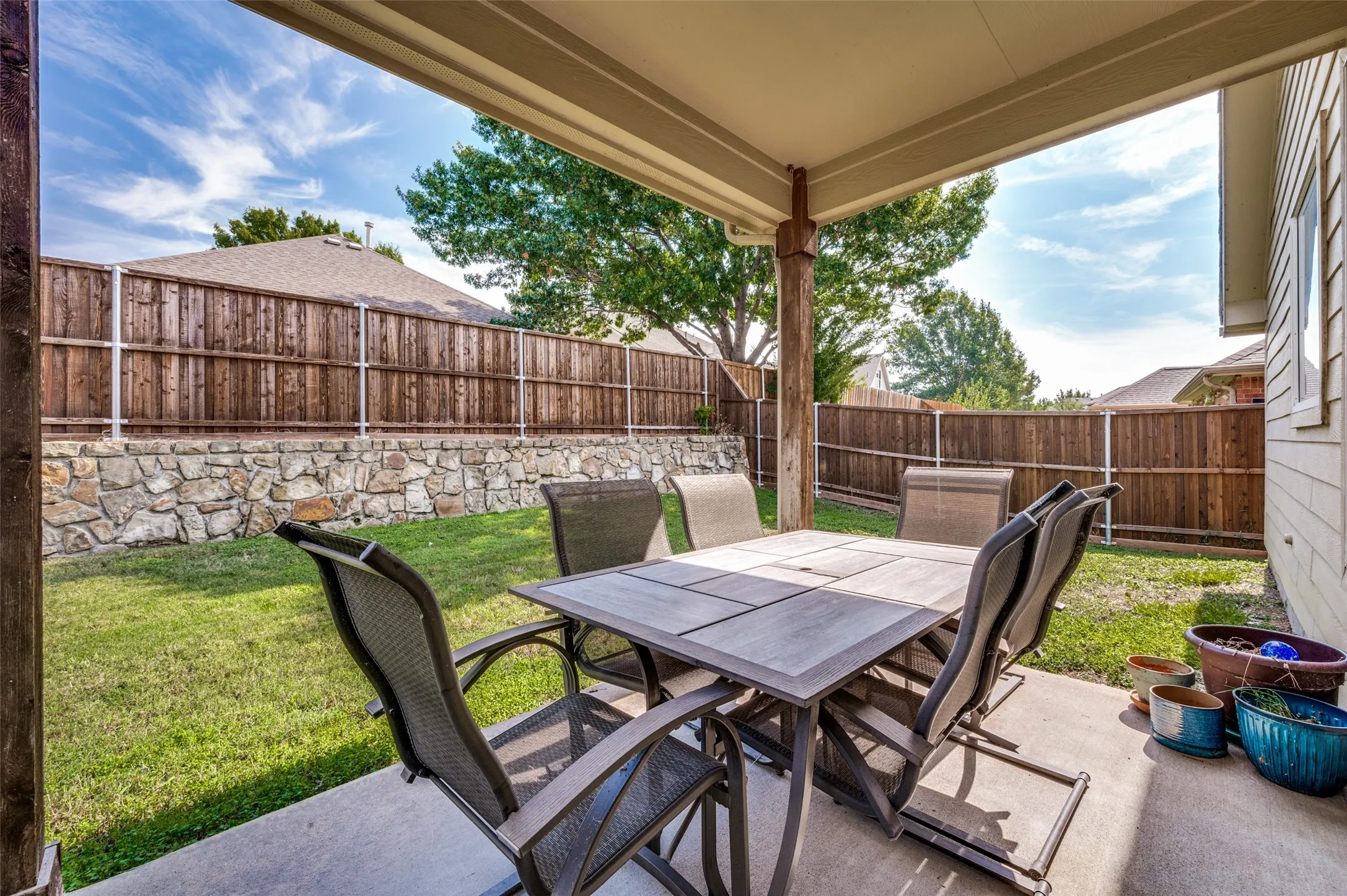 Covered patio with room to house a large table out back that sits 6, use as you please, run around room for the kids and pets, everyone welcome.