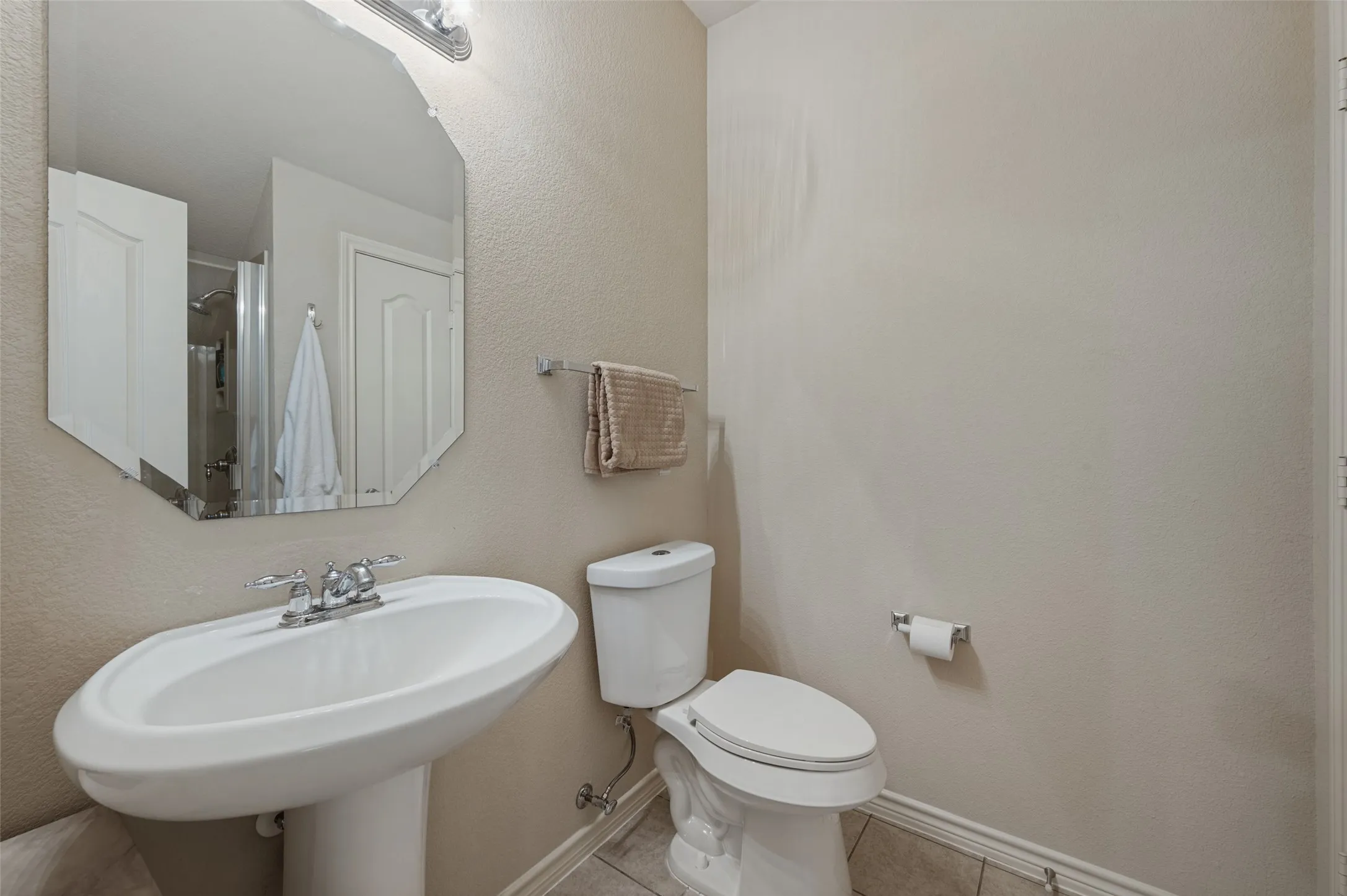 This is a full bathroom that is upstairs with the 4th bedroom secondary living space.