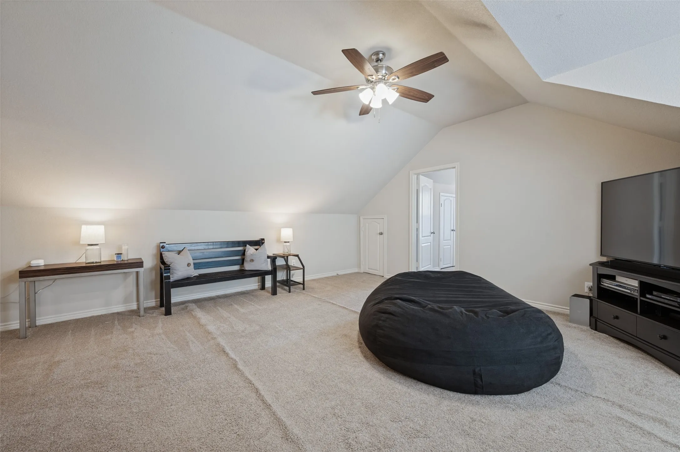 The story and half area is used here as a movie get together space. Also 4th bedroom and full bathroom are also up here making it a perfect stay for out town guest, extra family and long stays.