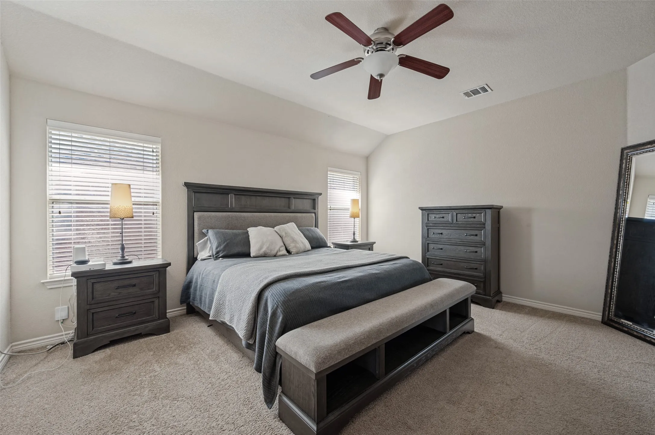 Large primary bedroom , windows with light to filll room , king size bed fits plus extra room for bigger side tables. Primary also is off kitchen and living room, if you get those mid night snack attacks, youre in there. Want to fall asleep on the couch, just short skip to the primary bedroom with ensuite.